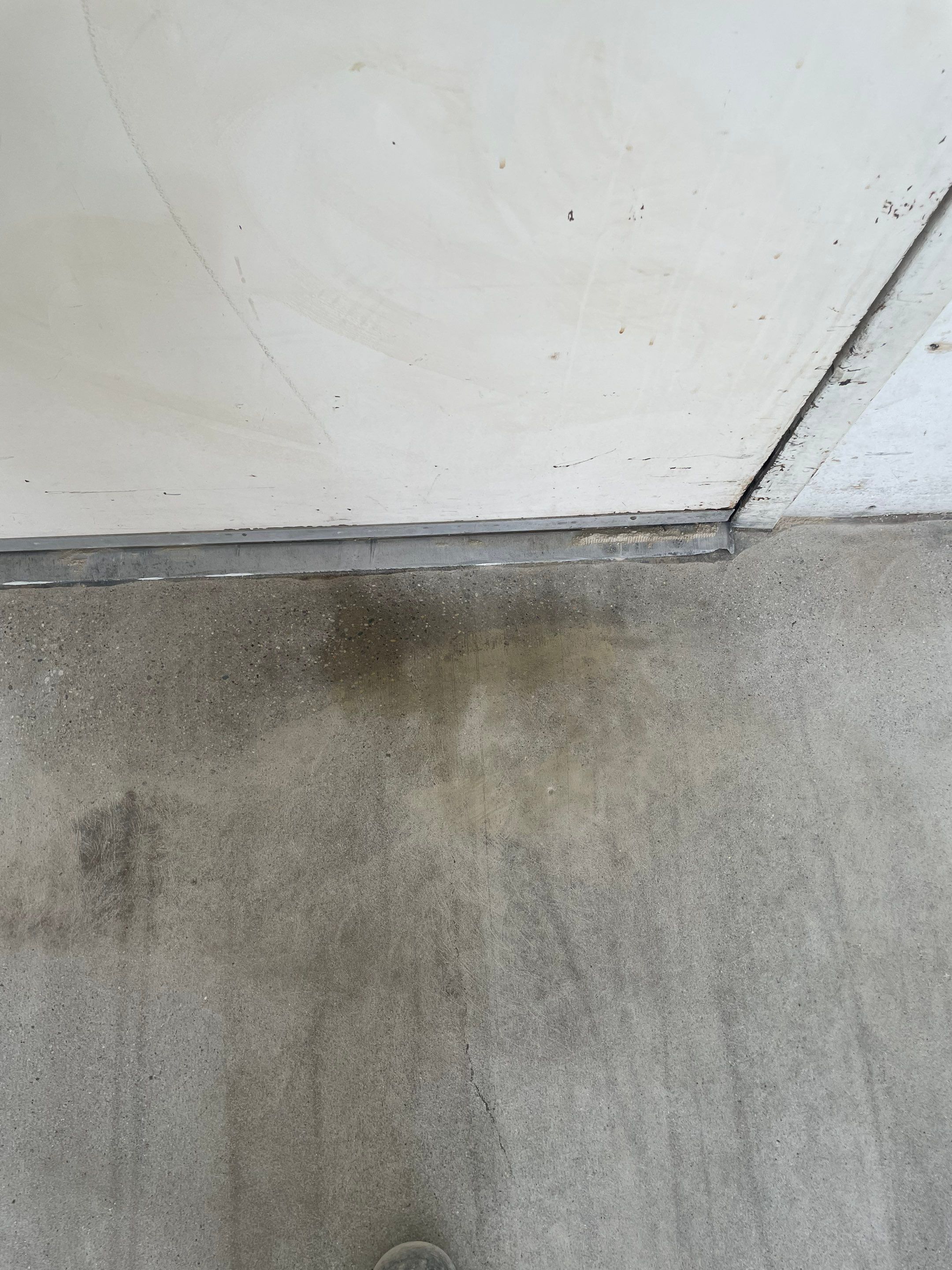 Coyote Flake Concrete Coating for Sioux Falls Garage by Select Painting, Coatings & Garage Cabinets