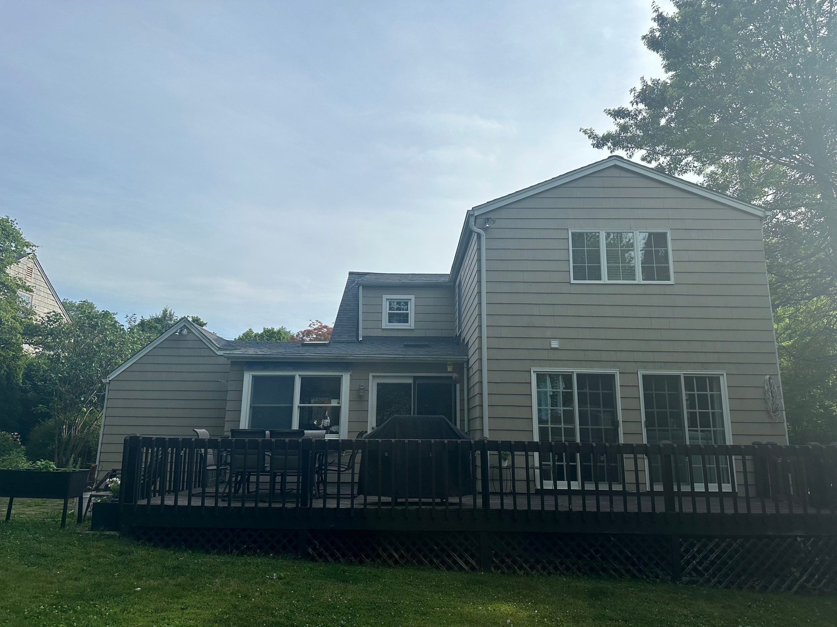 Complete Exterior Estate gray with Pacific Blue Siding by A Plus Exterior