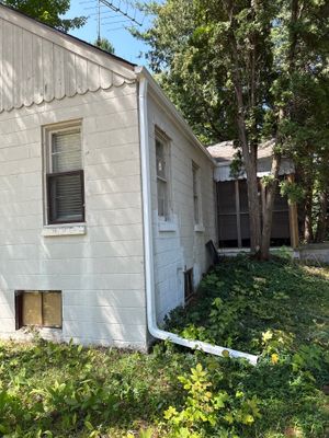 White Metal Gutter and Downspout Installation in Bellaire