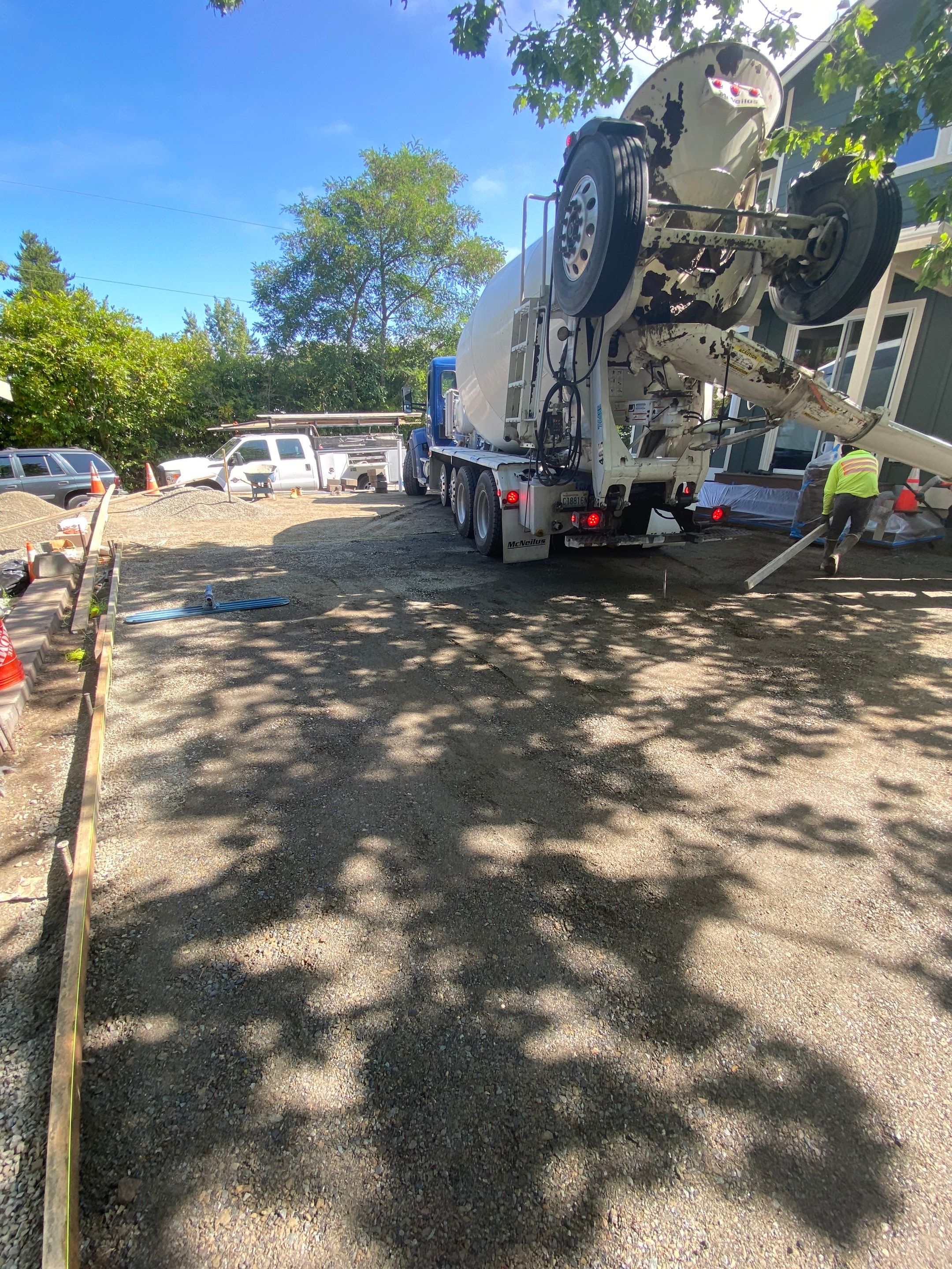 Patio Installation using Concrete, Retaining walls, and Turf install by Jireh Asphalt & Concrete Inc 