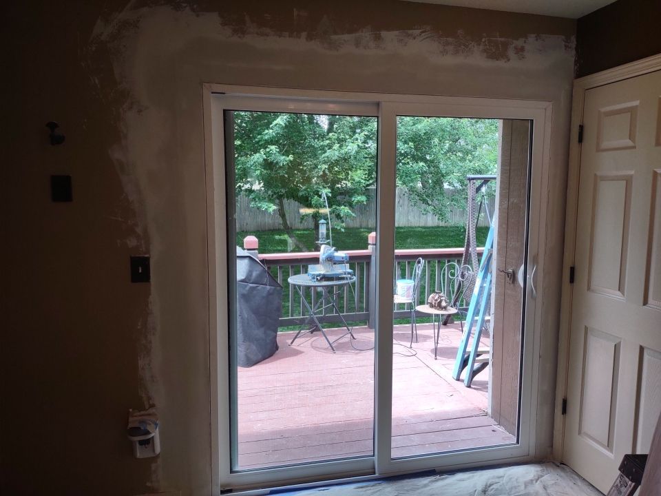 Siding Installation using Heartland Patio Door by EEC  Windows, Siding & Roofing 