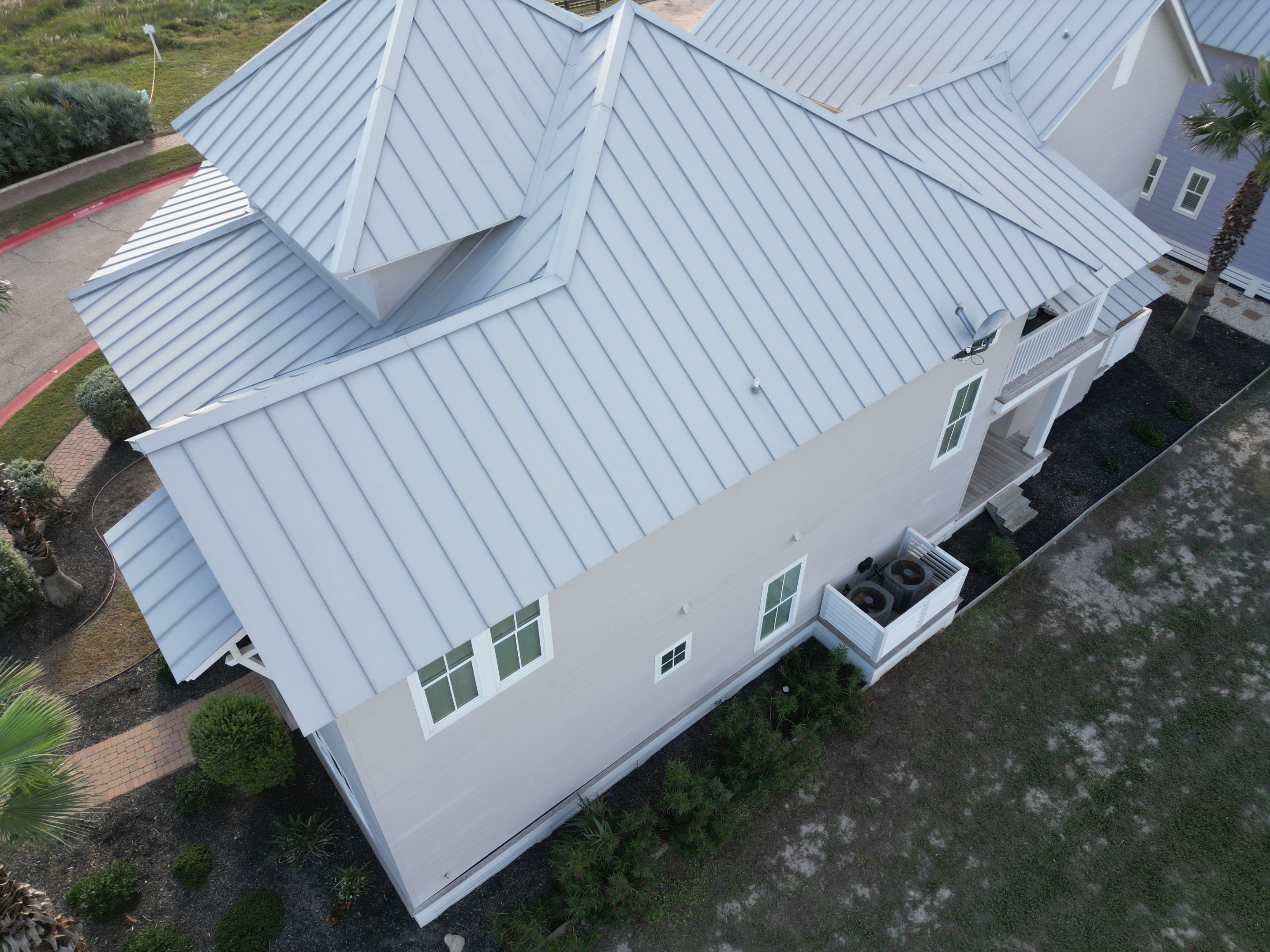 Residential Roof Replacement using 24 GA Double-Lock - Match Dove Grey by Action Exteriors Austin