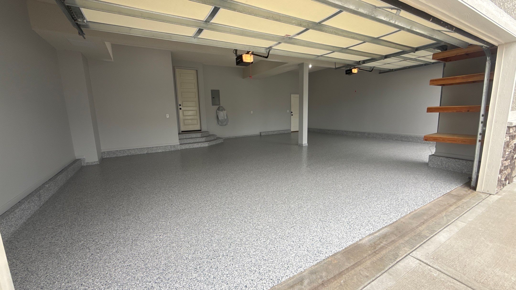 Comprehensive Garage Renovation Featuring Epoxy Flooring and Custom Storage in Shawnee by Banner Garage