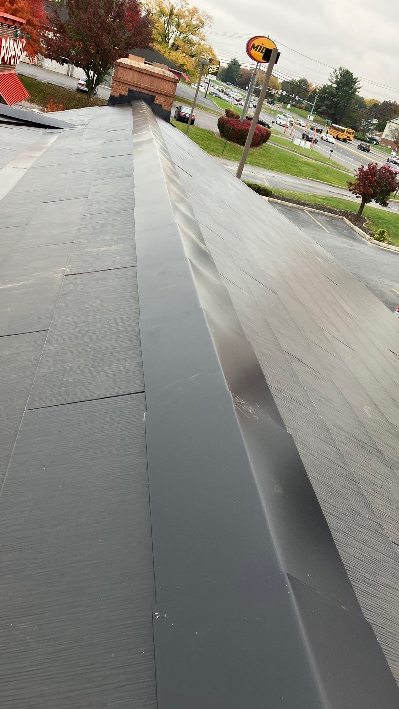 Tesla Solar Roof on a Commercial Building by American Home Contractors