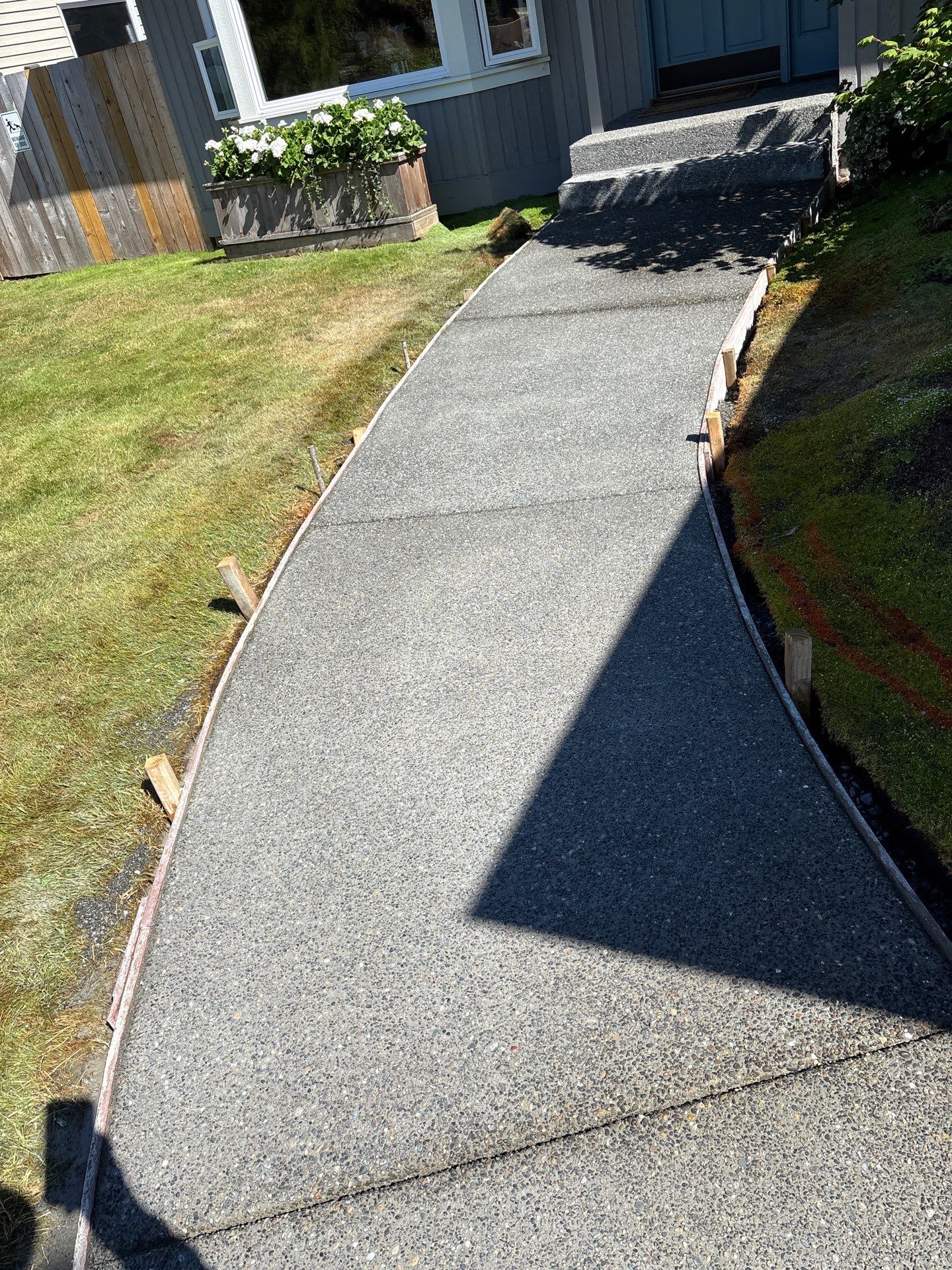 Exposed Aggregate Concrete Driveway Makeover  by Jireh Asphalt & Concrete Inc 