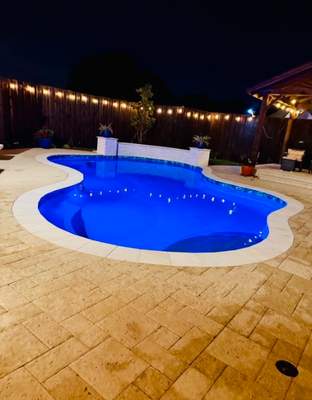 Resort-Style Freeform Pool with Travertine Decking