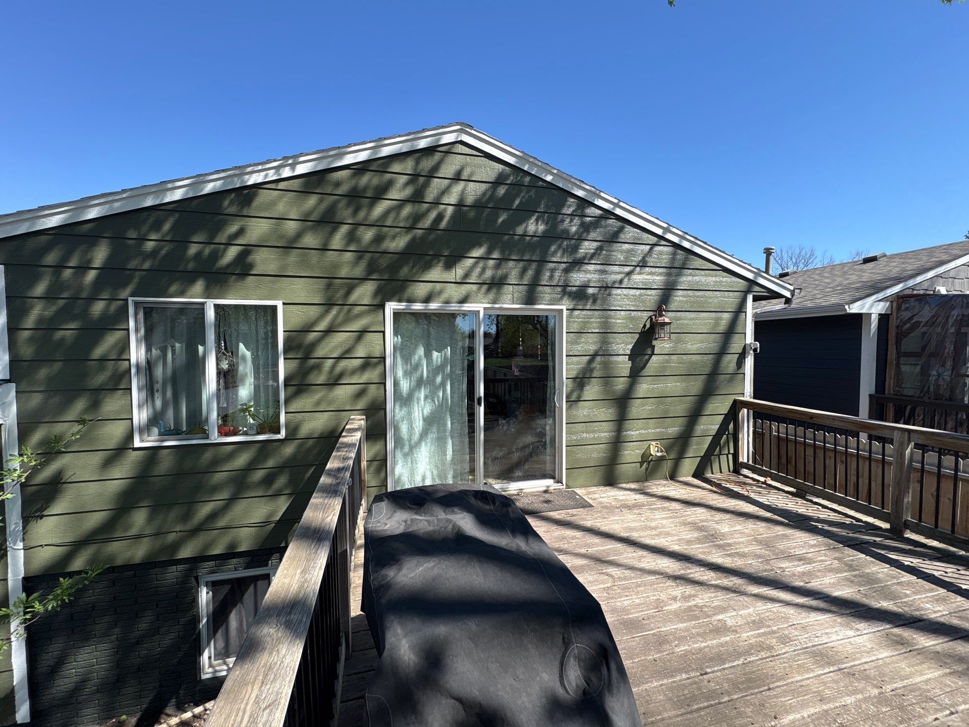 Full Exterior House Painting and Foundation Refinishing in Sioux Falls by Select Painting, Coatings & Garage Cabinets