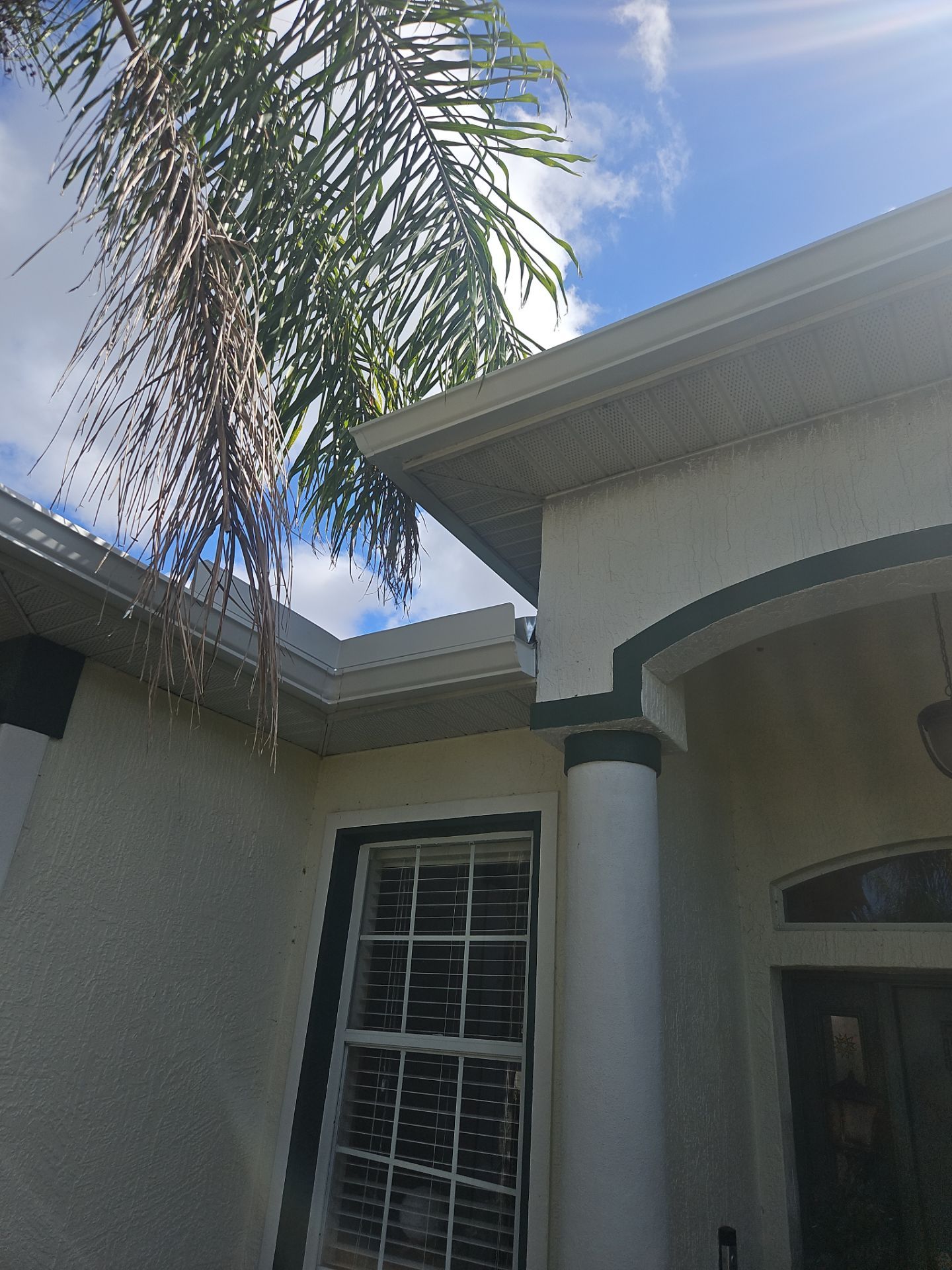 White seamless Gutters and downspout repair in Sarasota FL by Gutter Professors