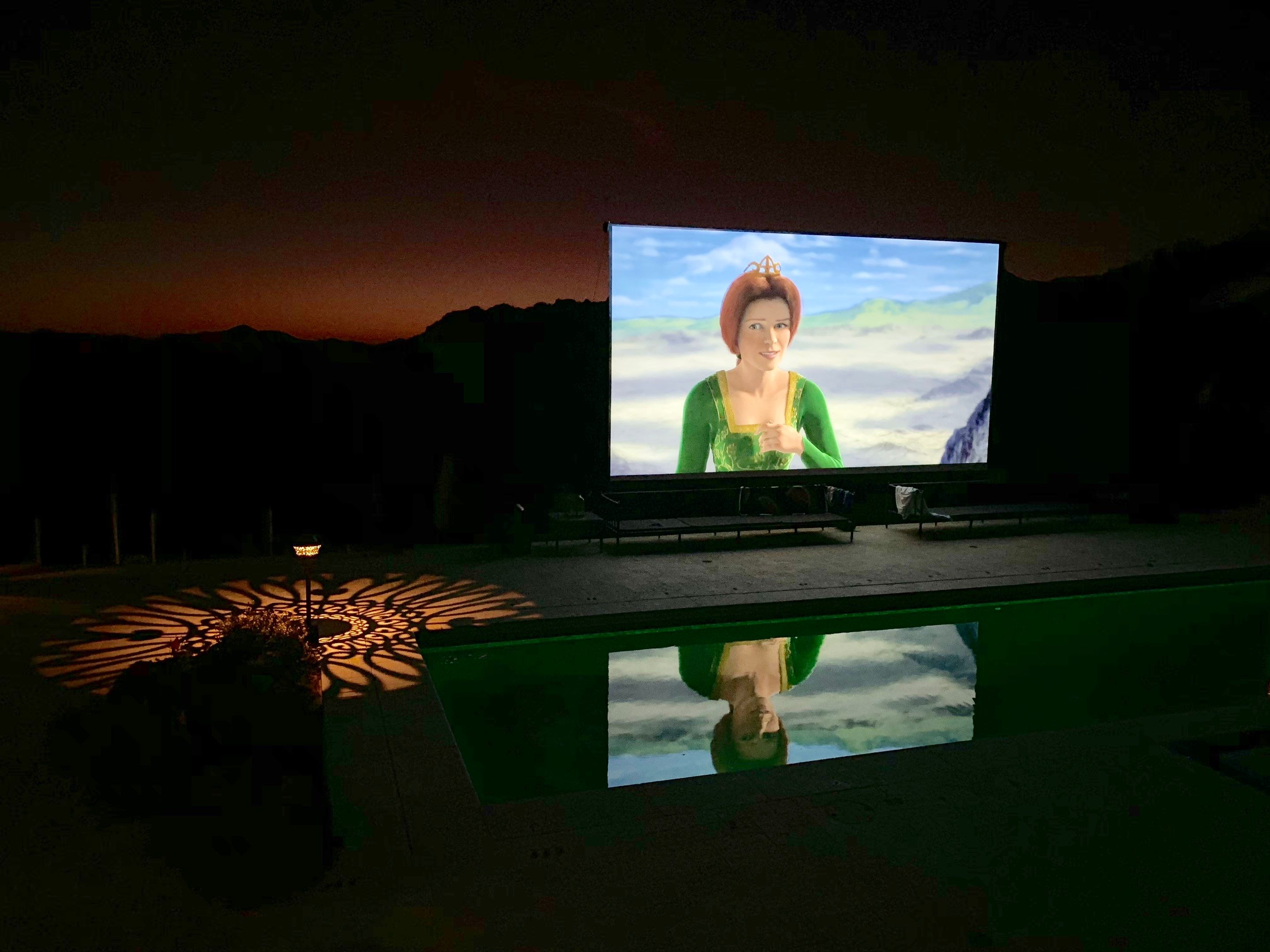 Malibu Hillside Outdoor Living Space with Custom Landscape Lighting + Surround Sound System by Outdoor Lights + Shades