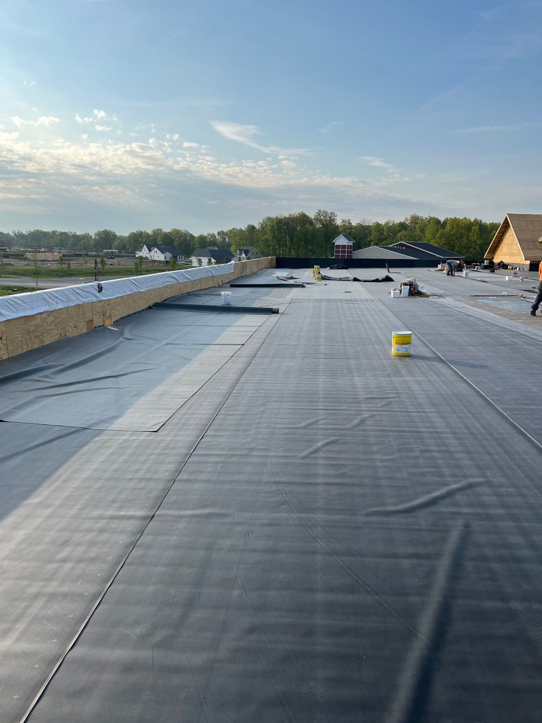 Commercial Roofing Installation using 60 mil rubber roof  by Nitro Roofing and Construction