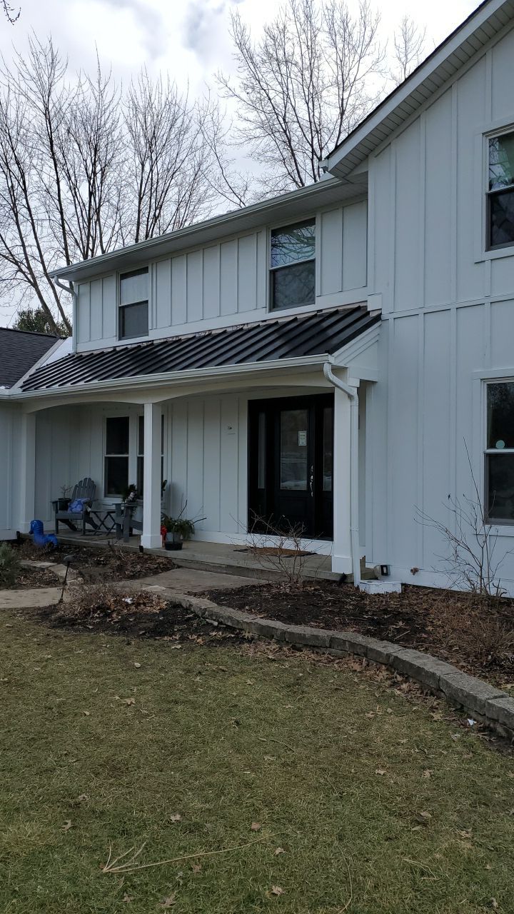 James Hardie Siding  using James Hardie Board and Batten, White by Absolute Roofing and Construction