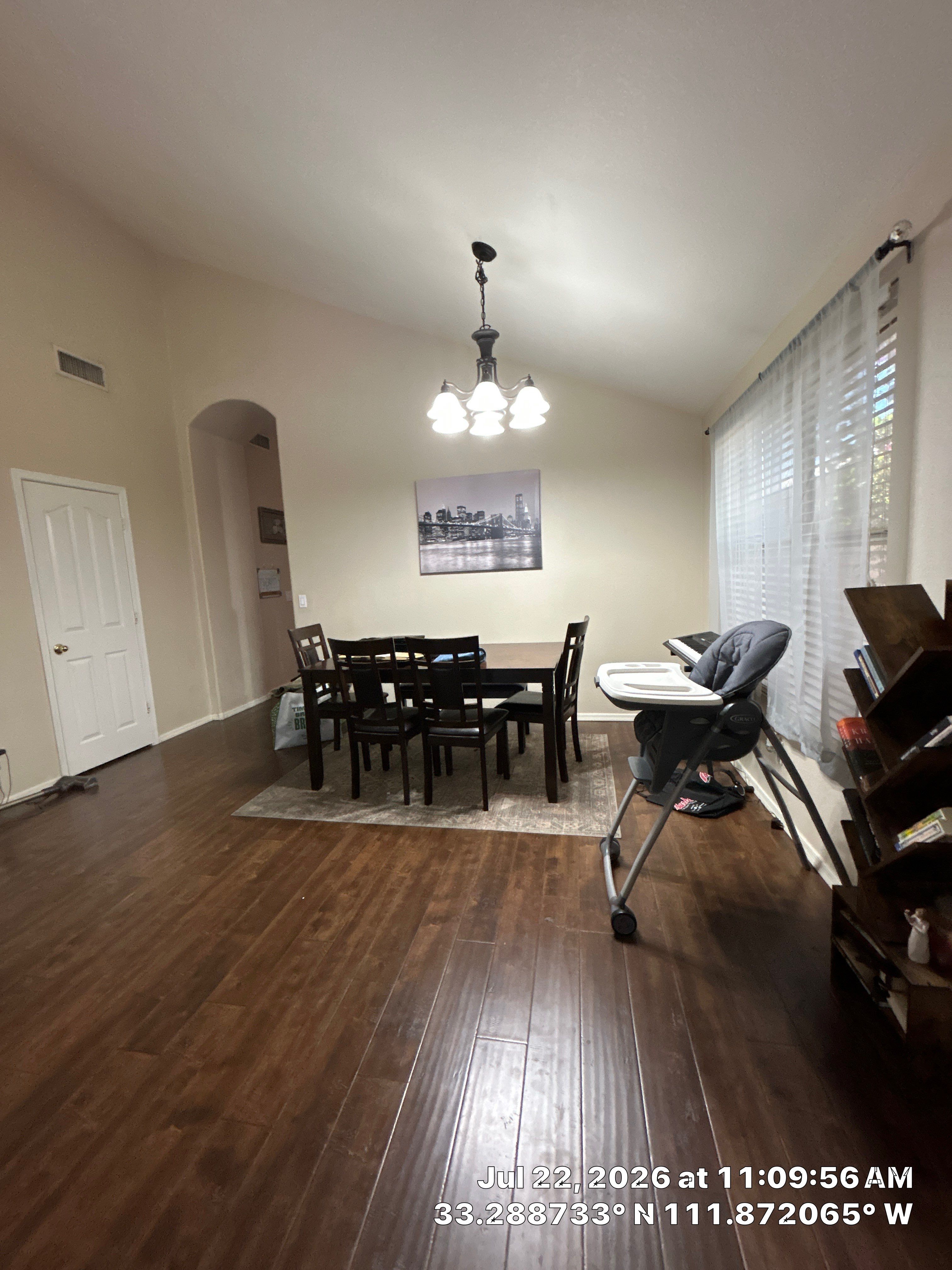 Chandler Dining Room Floor Remodel with Dark Wood-Look Laminate by CompanyCam Sales Demo