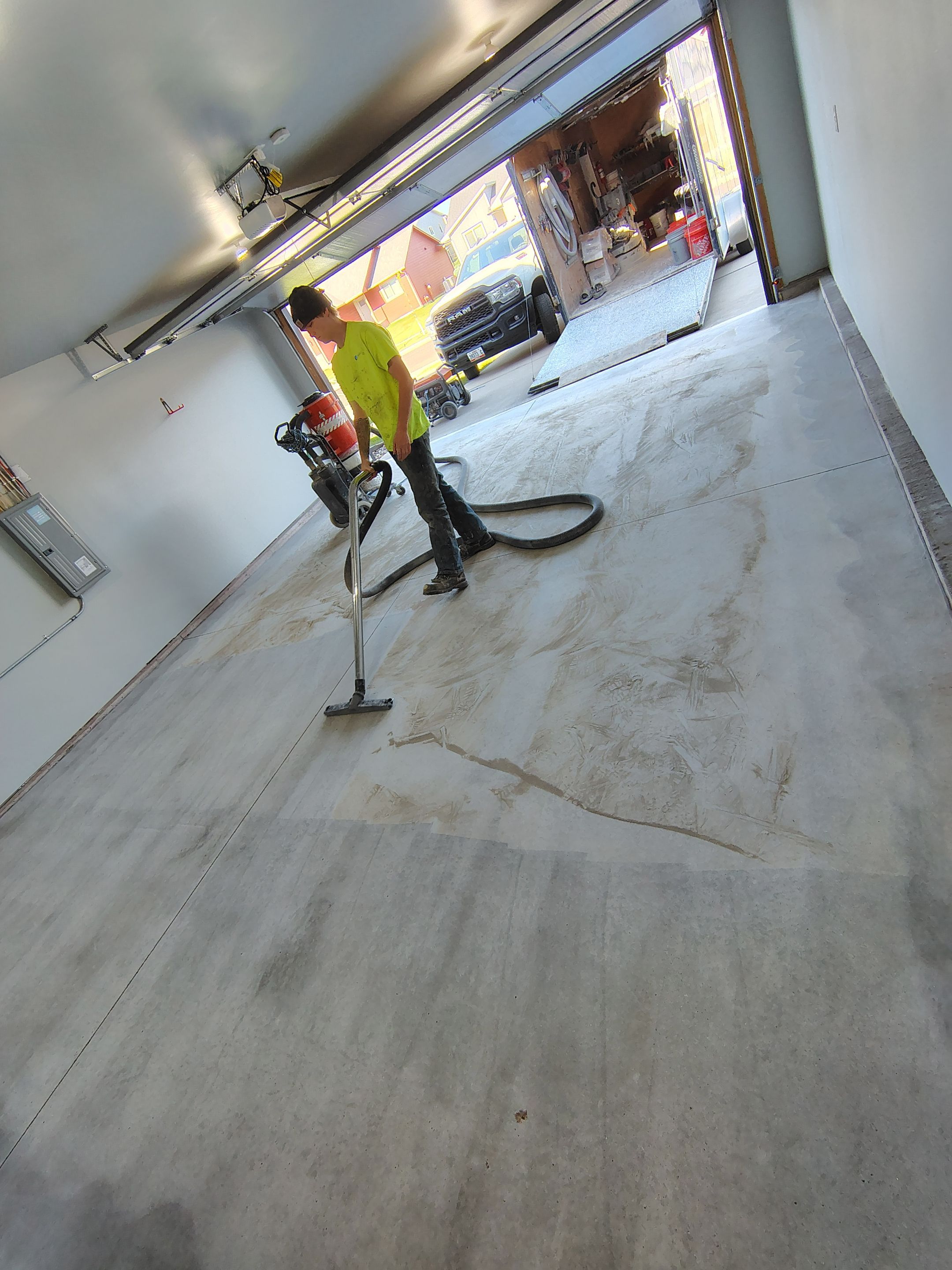 Custom Epoxy Garage Floor Coating Installation in Sioux Falls by Select Painting, Coatings & Garage Cabinets