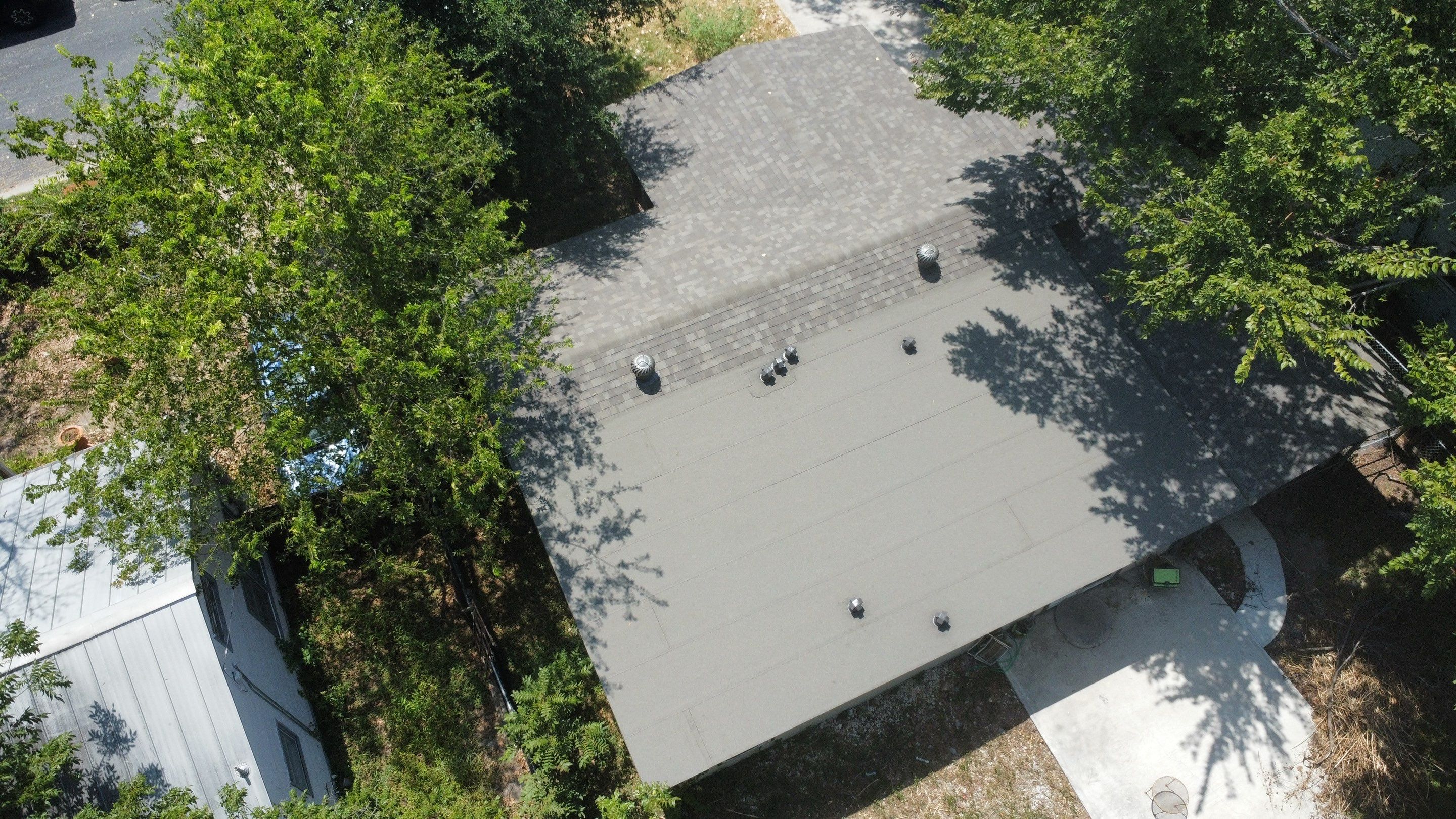 Mixed Roof System ā Oakridge Driftwood + Flat Roof Section | Austin, TX by Kstylez Roofing & Construction