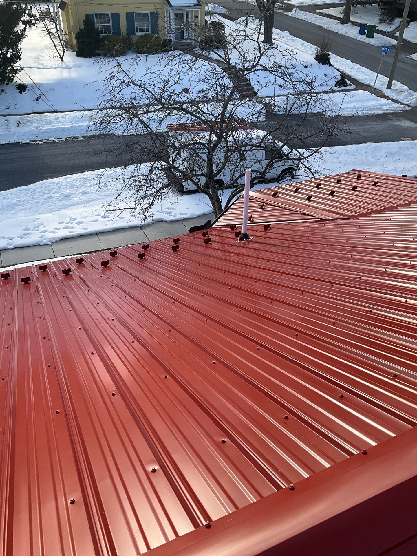 Red Metal Roofing Upgrade for Brick Home by Esh Builders