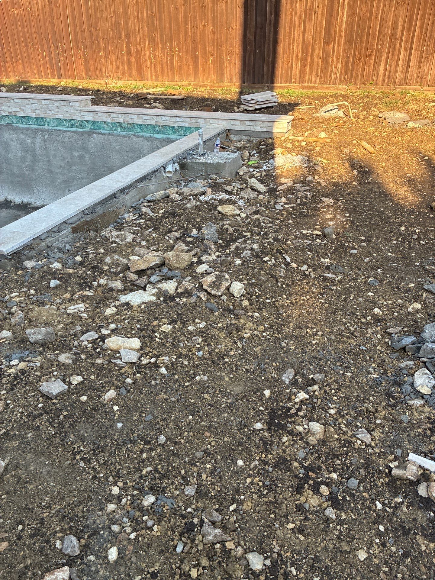 Modern Geometric Pool with Travertine Coping and Lush Landscaping by Pinnacle Pools and Spas - DFW