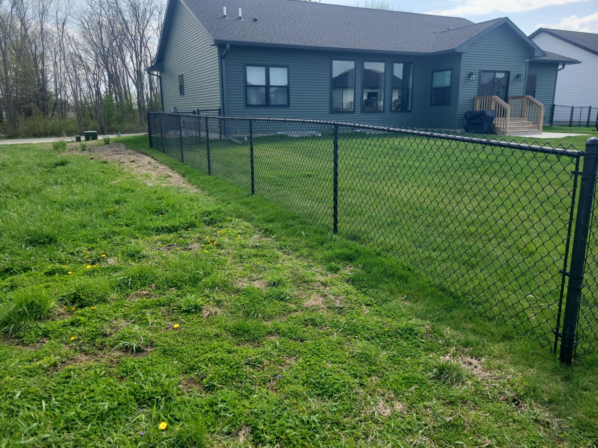 Black Chain Link Fence and Gate Installation in Cedar Falls by Perfect Picket Fence and Stain