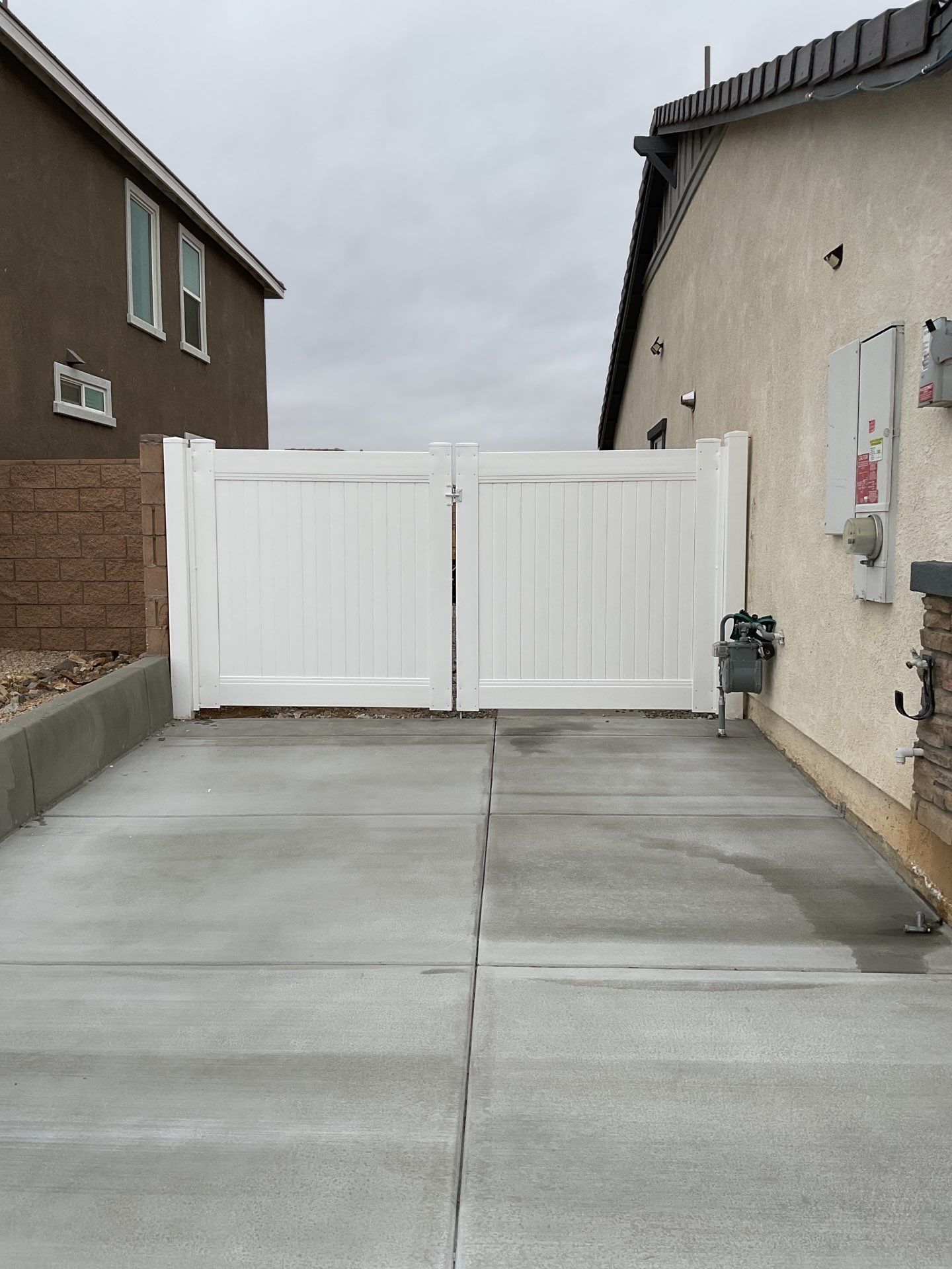Gate installation using Vinyl by Fence Guys Inc. 