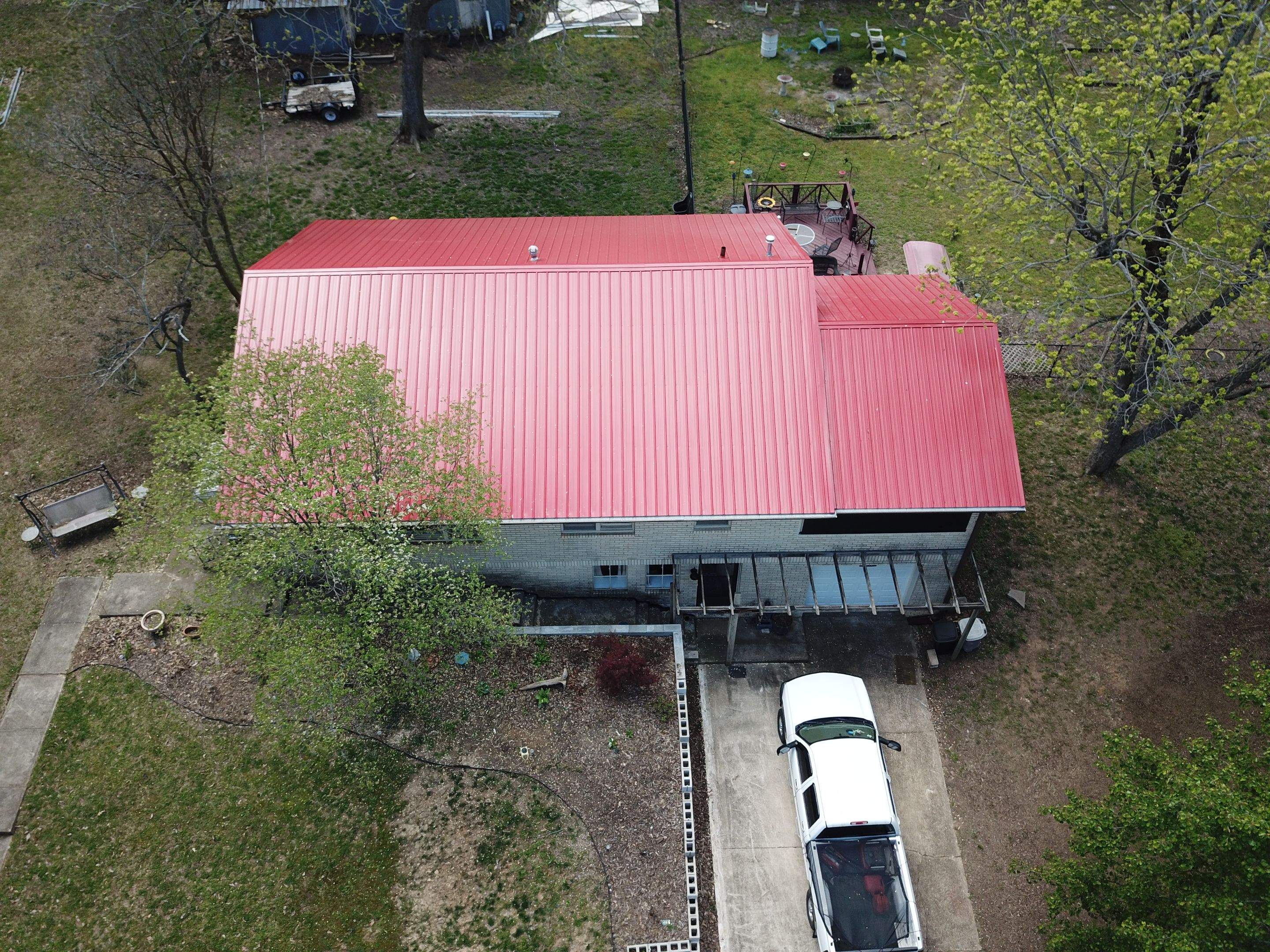 Residential Roofing Installation using 26 Gauge Colored Panels by Hostetler Roofing