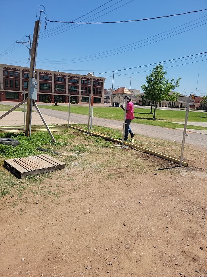 Cedar Fence using Cedar Pickets and Metal Poles by Clays Services Inc