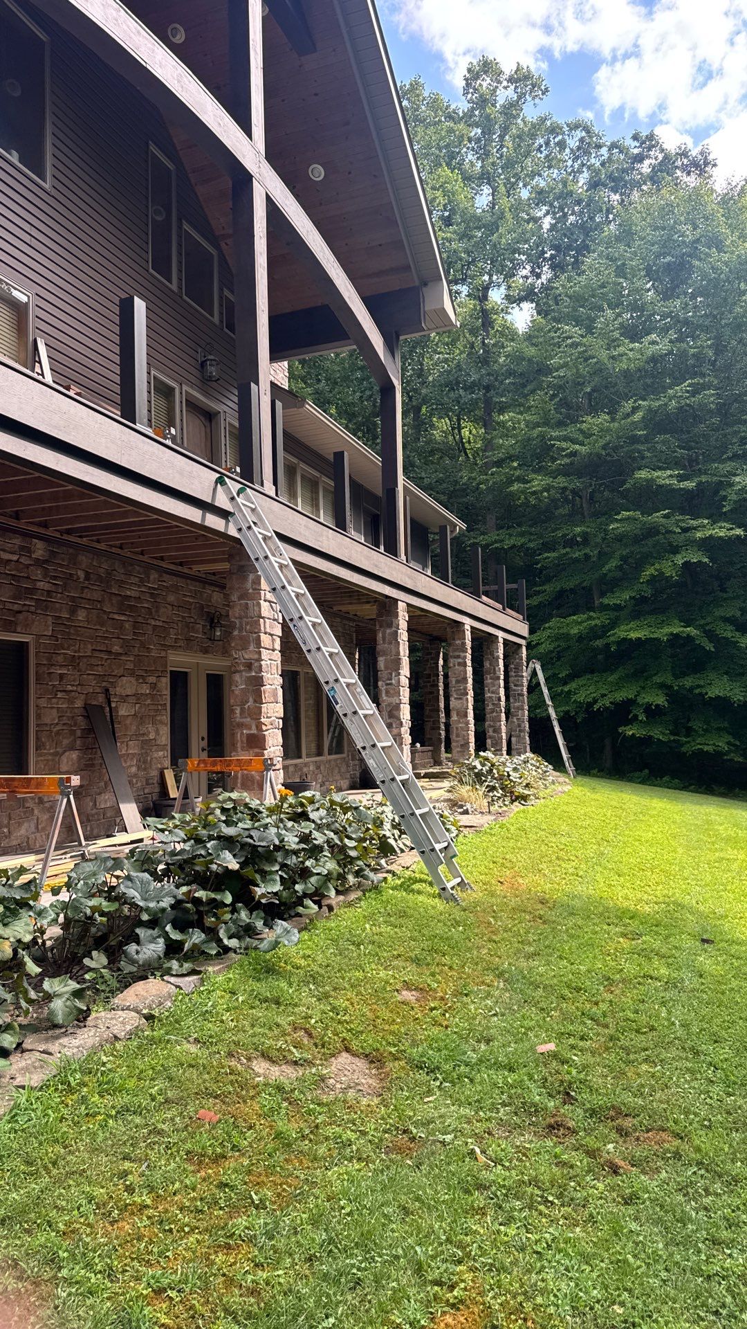 Custom Composite Deck Construction with Stone Pillars in Fayetteville by Walnut Hollow Decks & Outdoor Living