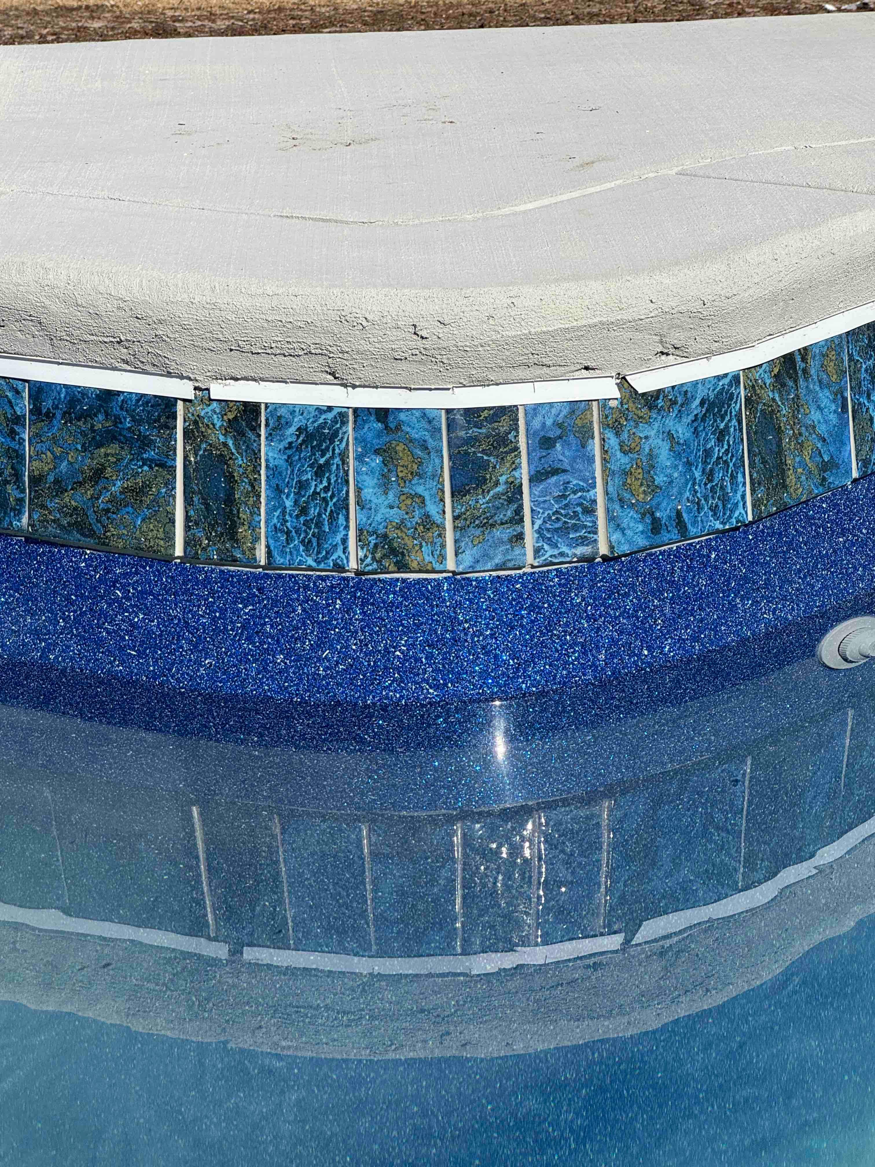 Freeform Pool with Raised Spa and Blue Tile by Pinnacle Pools and Spas - DFW
