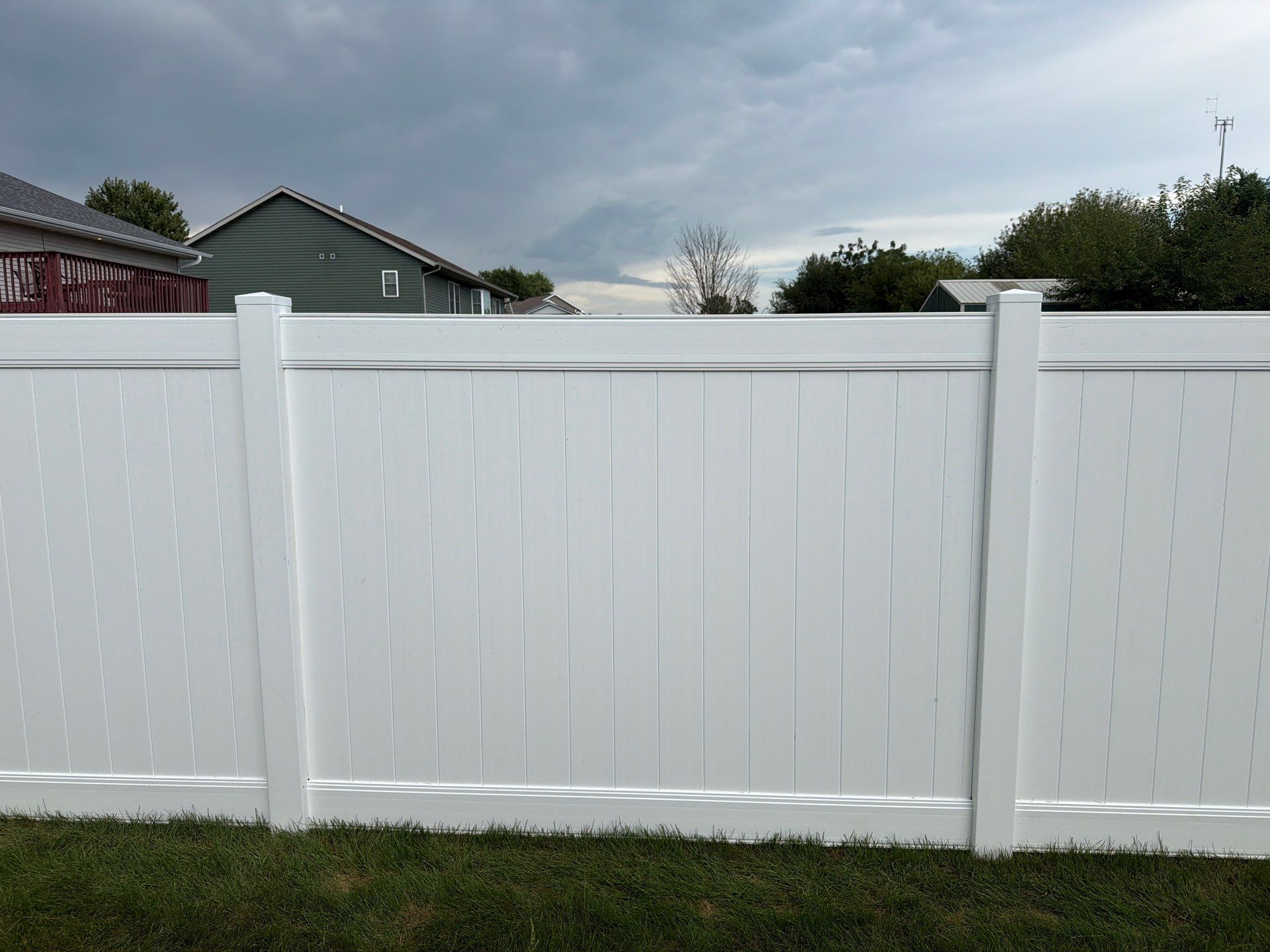 White Vinyl Privacy Fence Installation in Raymond, IA by Perfect Picket Fence and Stain