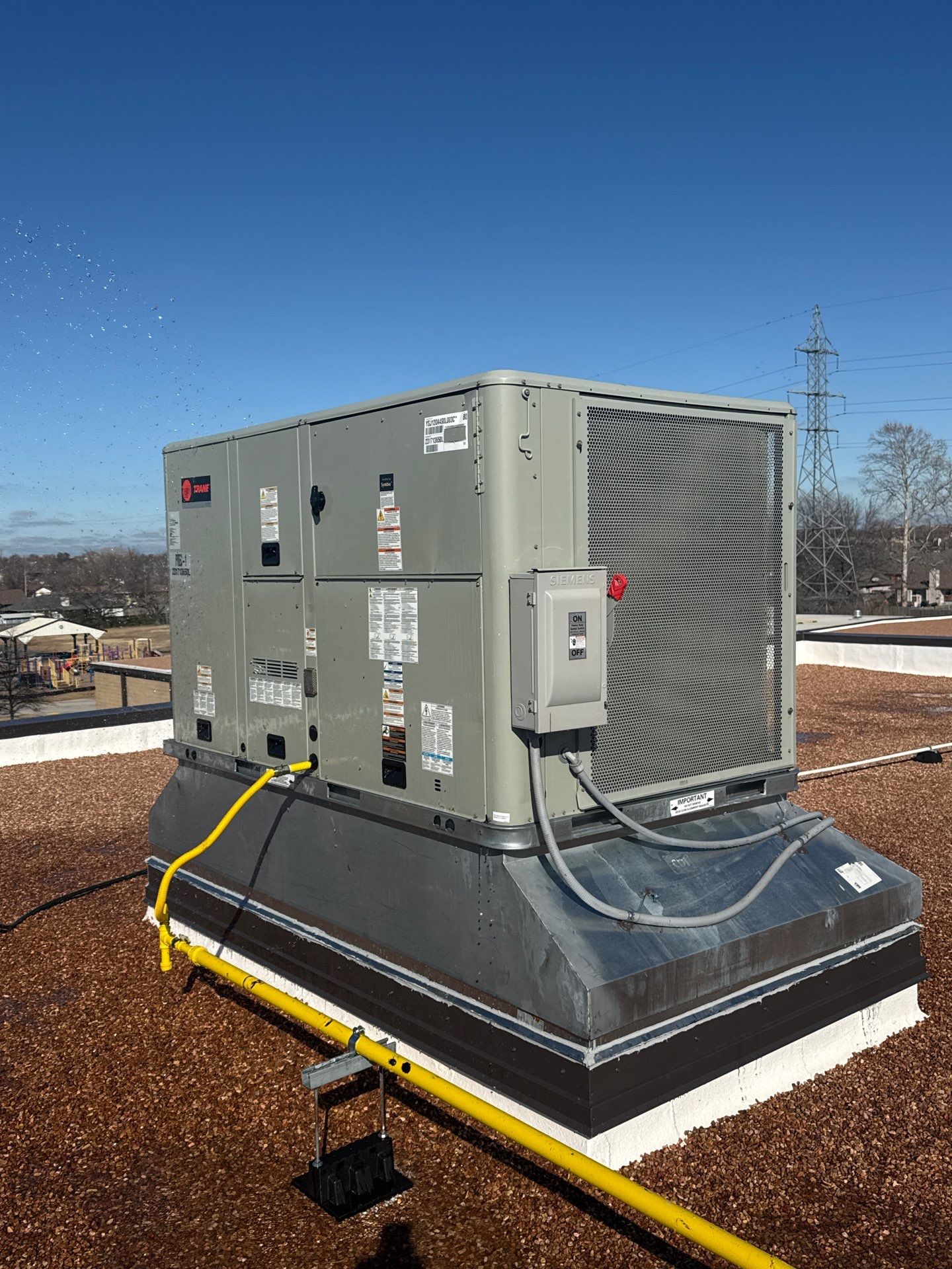 Mills Elementary School Commercial Re-Roof and Moisture Protection by Secondary Rhodes