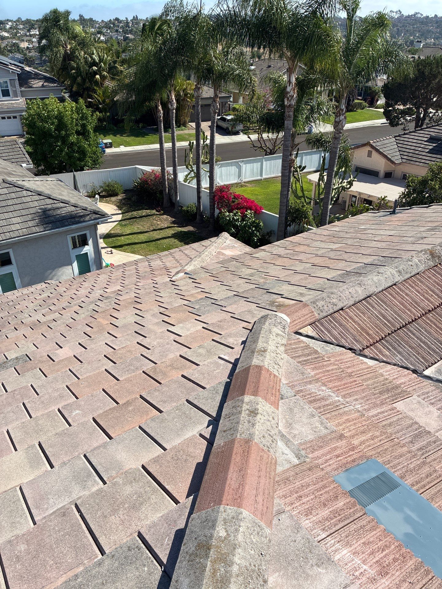Carlsbad Concrete Tile Roof Replacement with Copper Flashing and Skylights by Reliable Roofing San Diego Inc.