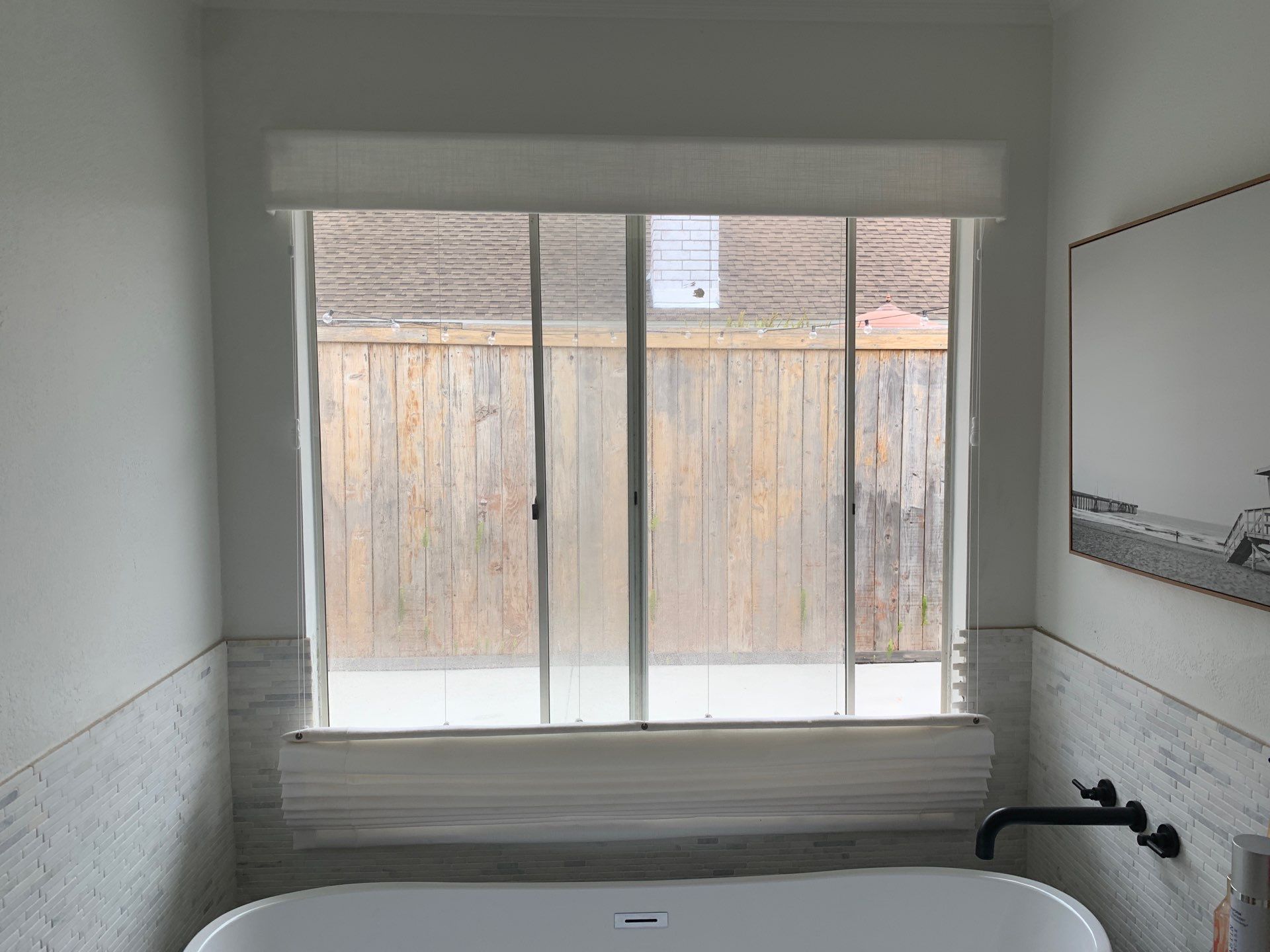 Window Installation using Milgard black vinyl windows by American Window Company