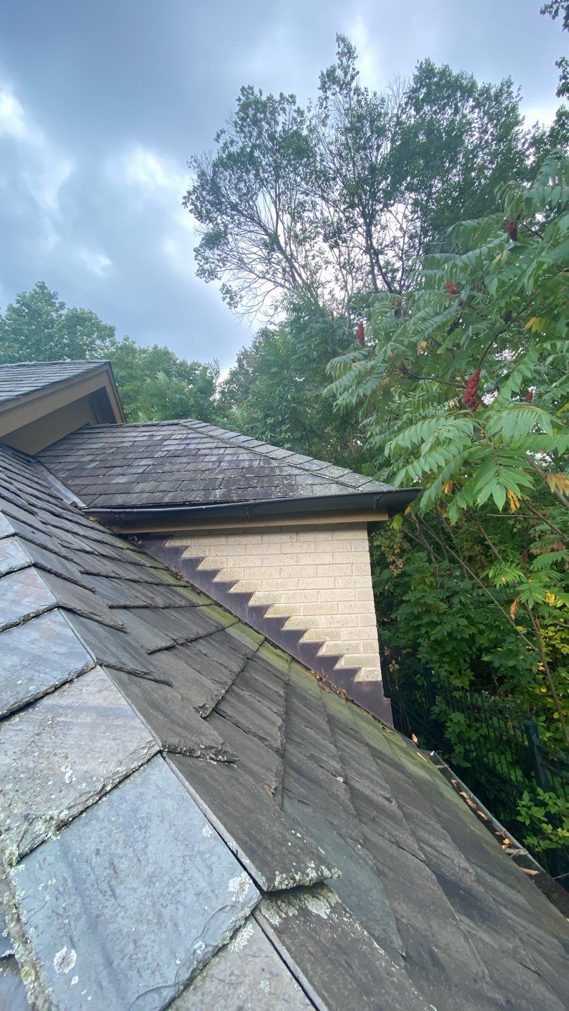 Slate Roof Replacement and Half Round Copper Gutter Installation by Custom Installations