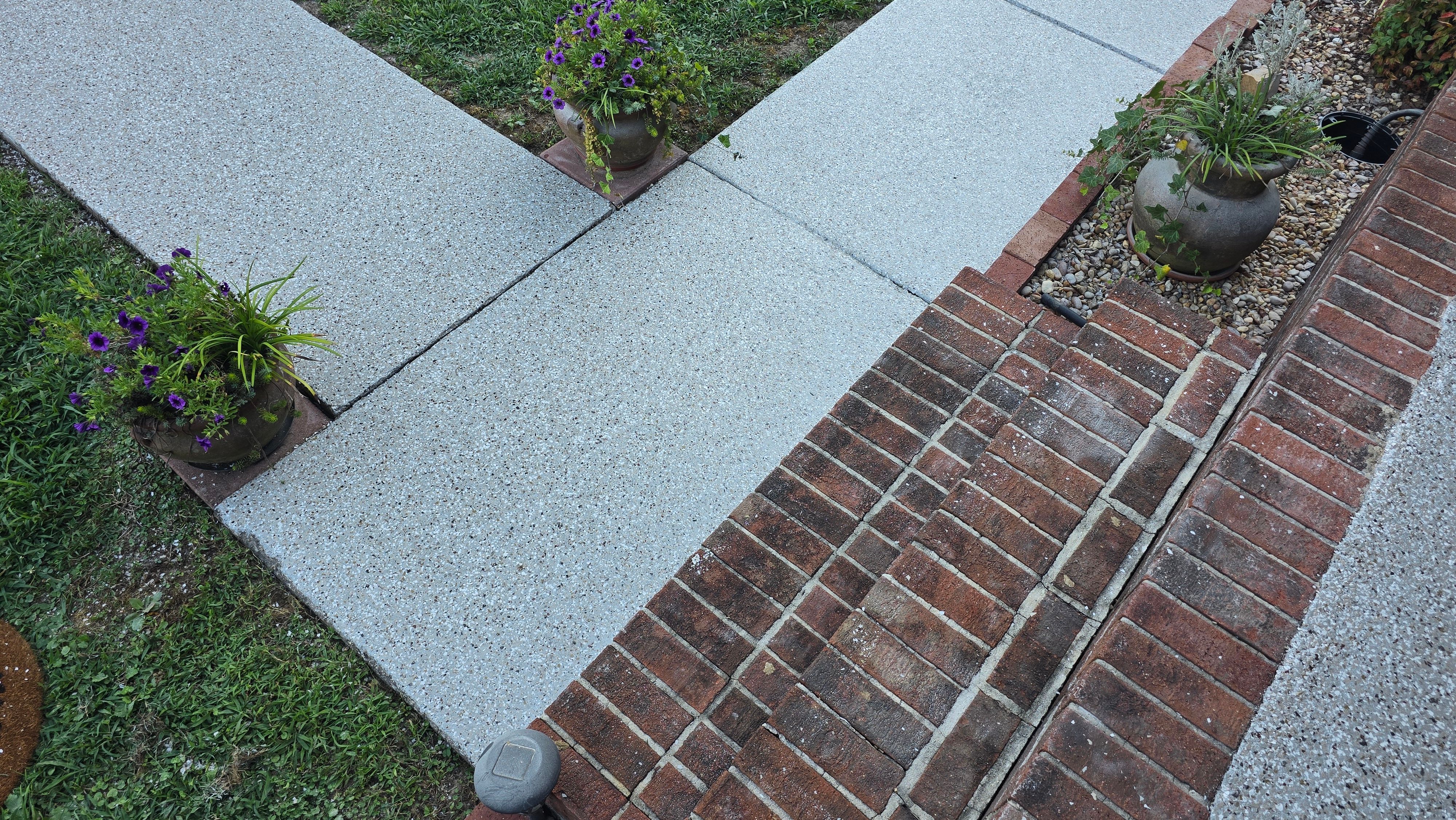 Driveway, Garage, Porch, and Sidewalk using Creekbed by Elite Floor Solutions