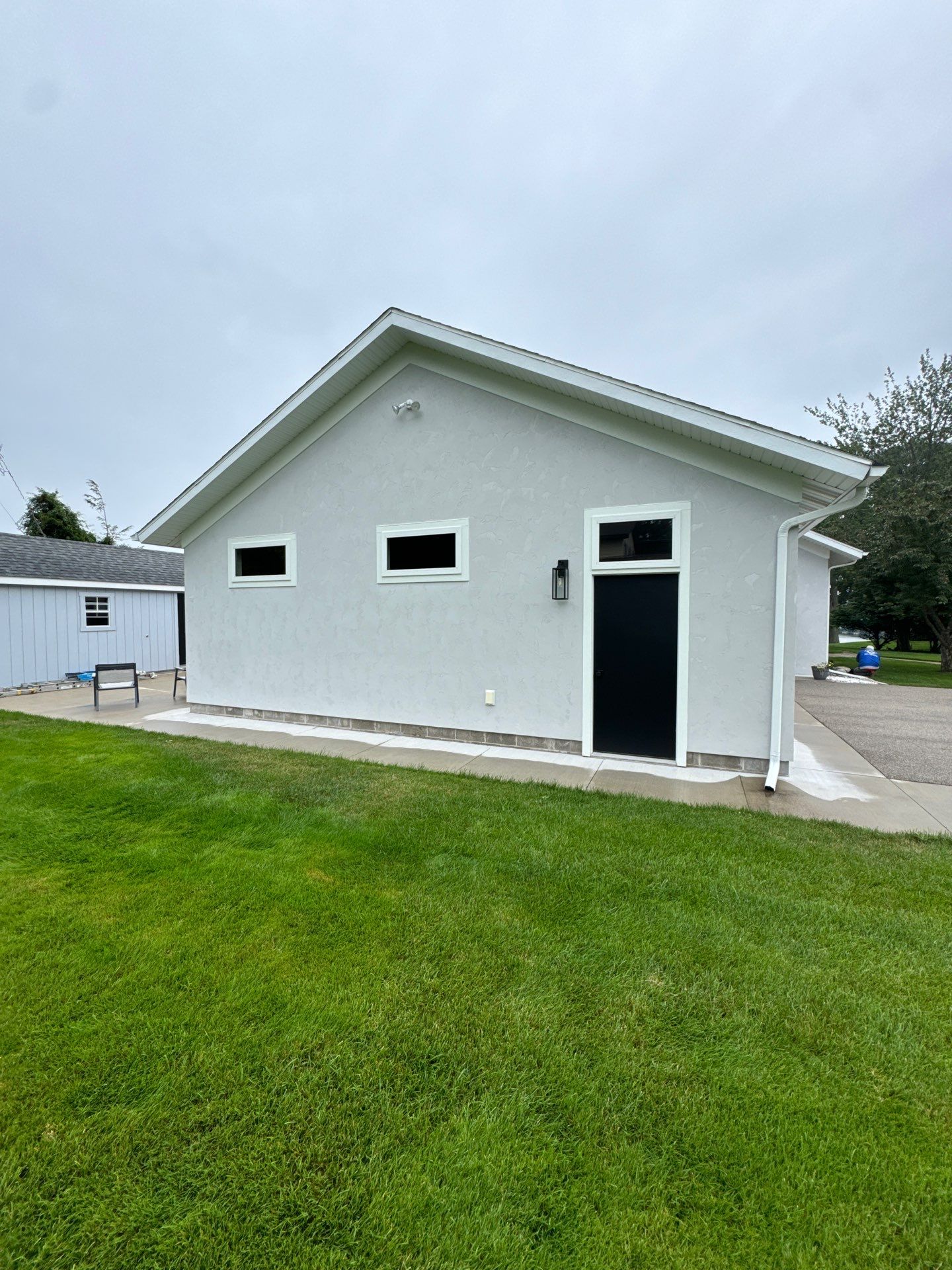 Norton Shores Residential Stucco Repair and Exterior Painting Refresh by Gordon Painting