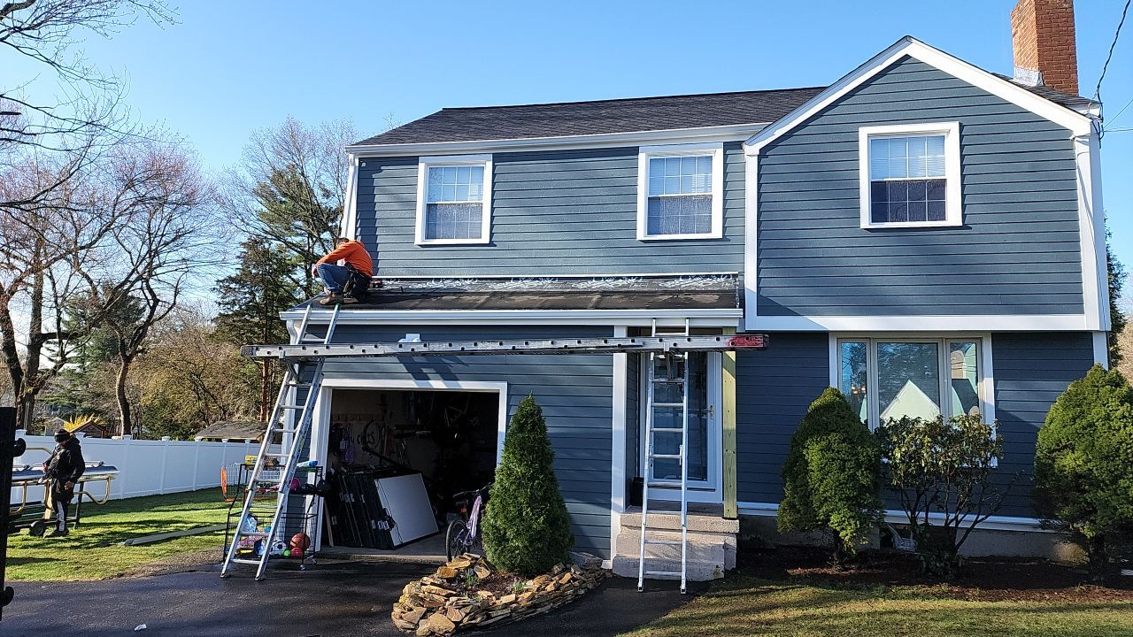 James Hardie siding, new metal roof and couple windows being installed. by UBrothers Construction