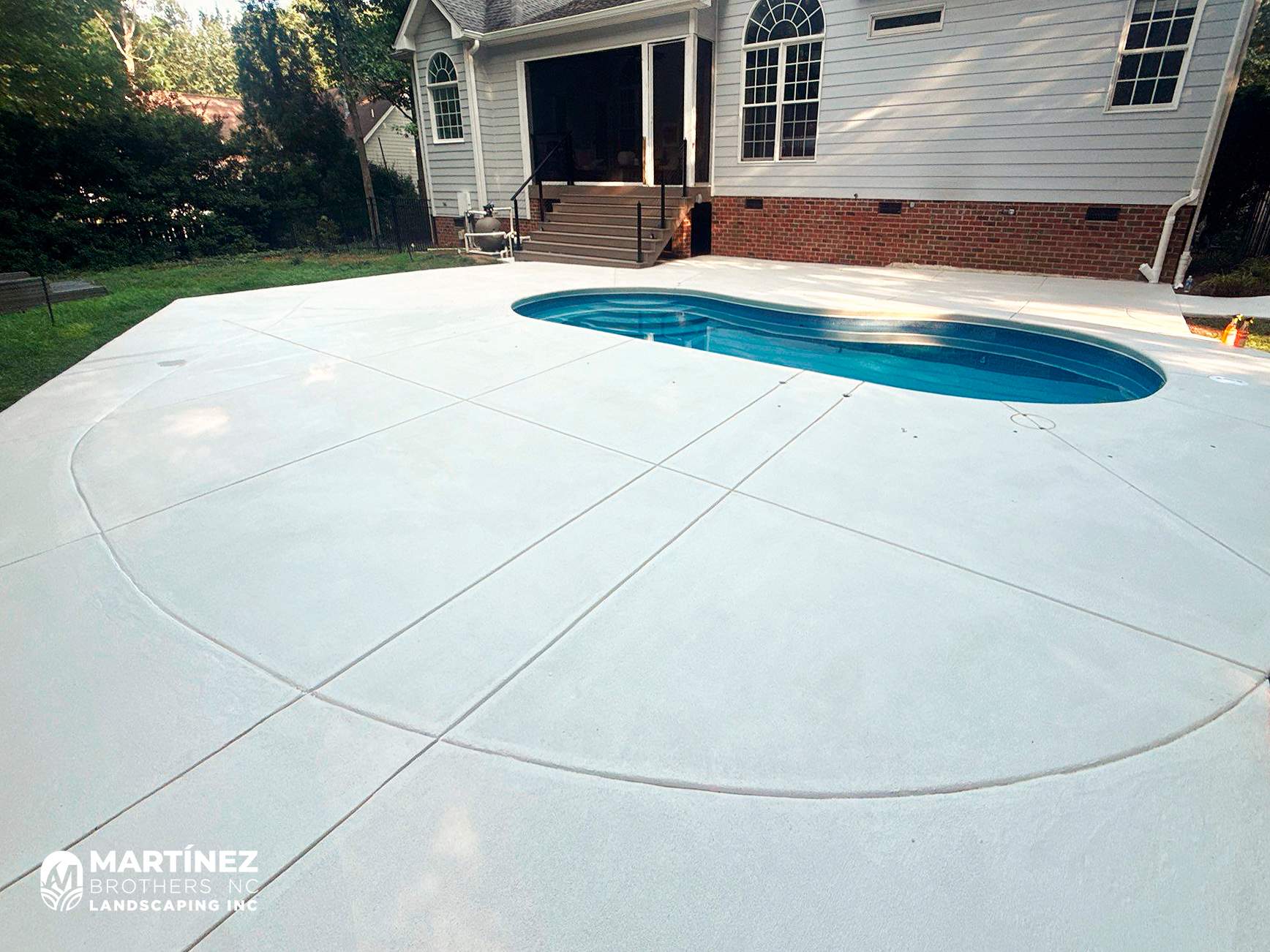 Cool decking pool in Youngsville by Martinez Brother’s Nc Landscaping Inc