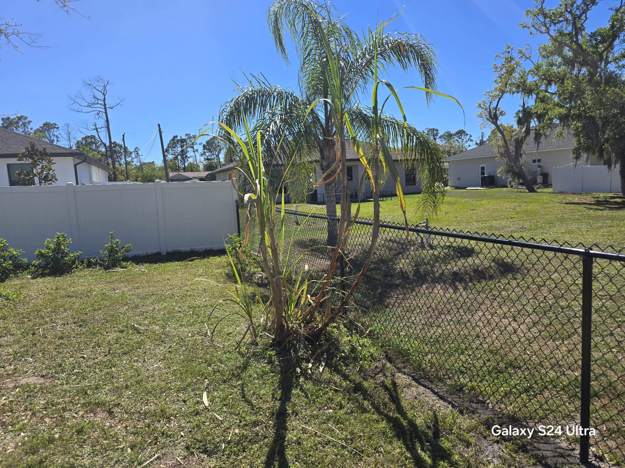 Residential Black Vinyl-Coated Chain Link Fence Installation in North Port by True Fence LLC