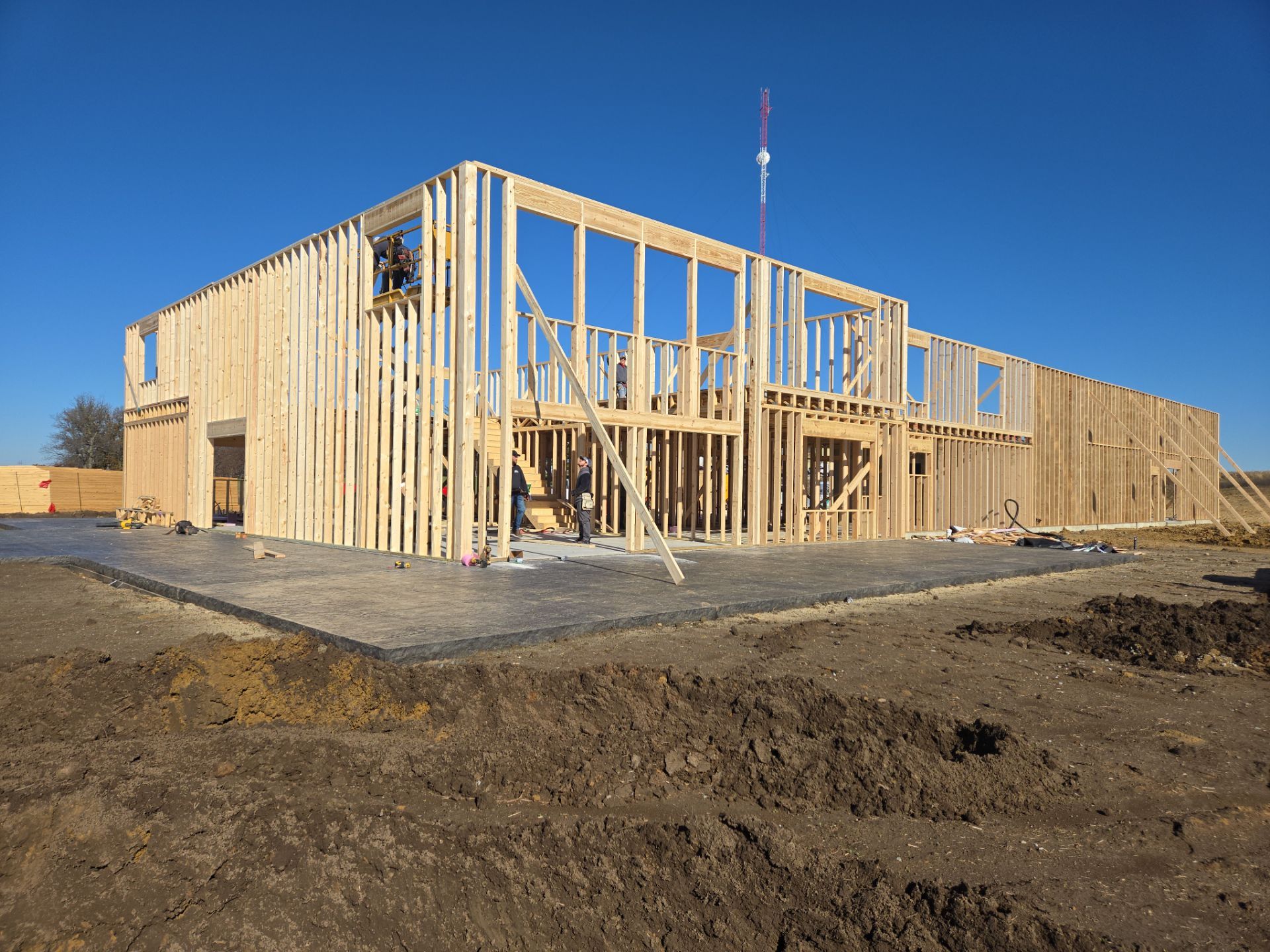 New Home construction w/ board and batten sides and metal roof  by Miles Construction 