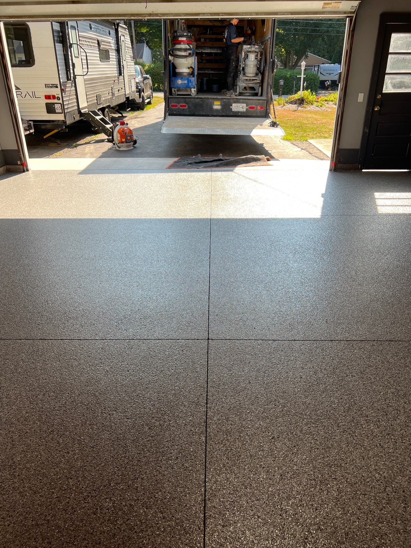 Concrete garage floor replacement and epoxy coating installed  by NG Masonry & Construction LLC