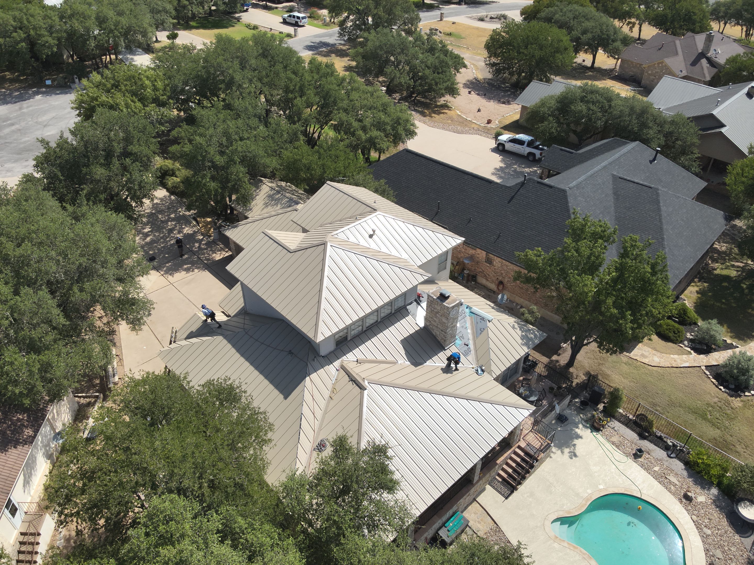 Residential Roof Replacement using 24 GA Double-Lock - Surrey Beige by Action Exteriors Austin