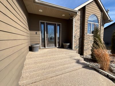 Full Exterior Renovation with Stone Veneer and Composite Decking