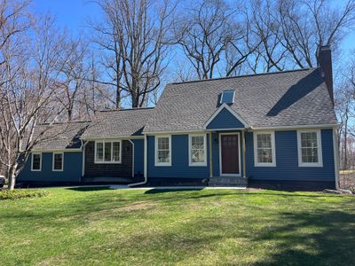 Asphalt shingles meet sleek siding in Guilford.