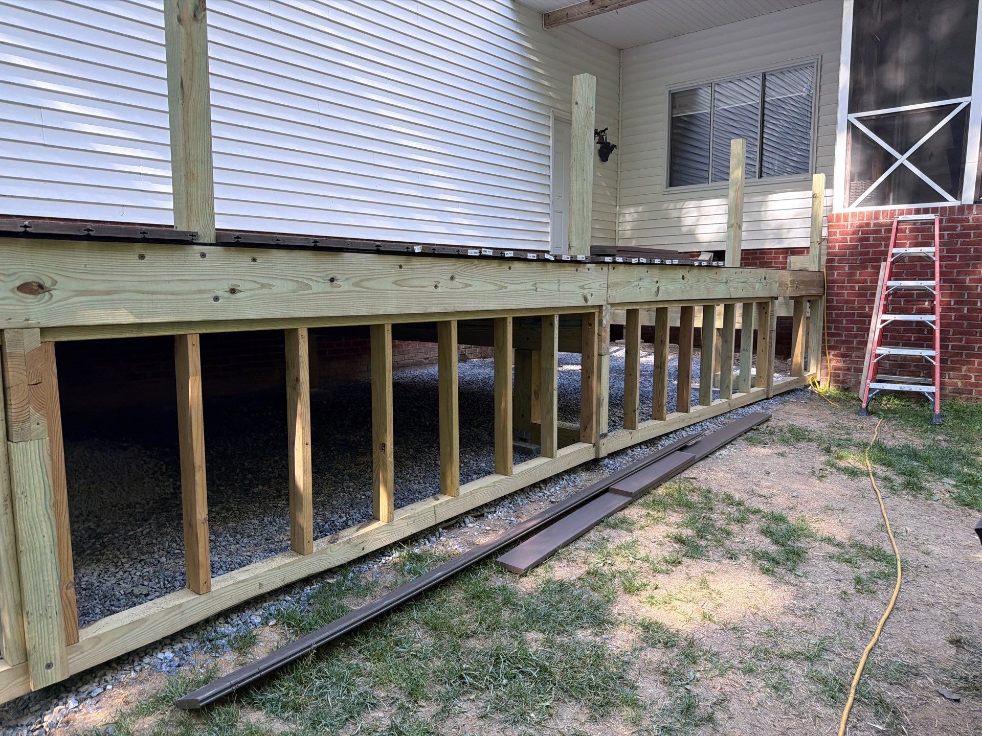 Custom Composite Deck and White Vinyl Railing Installation in Fayetteville by Walnut Hollow Decks & Outdoor Living