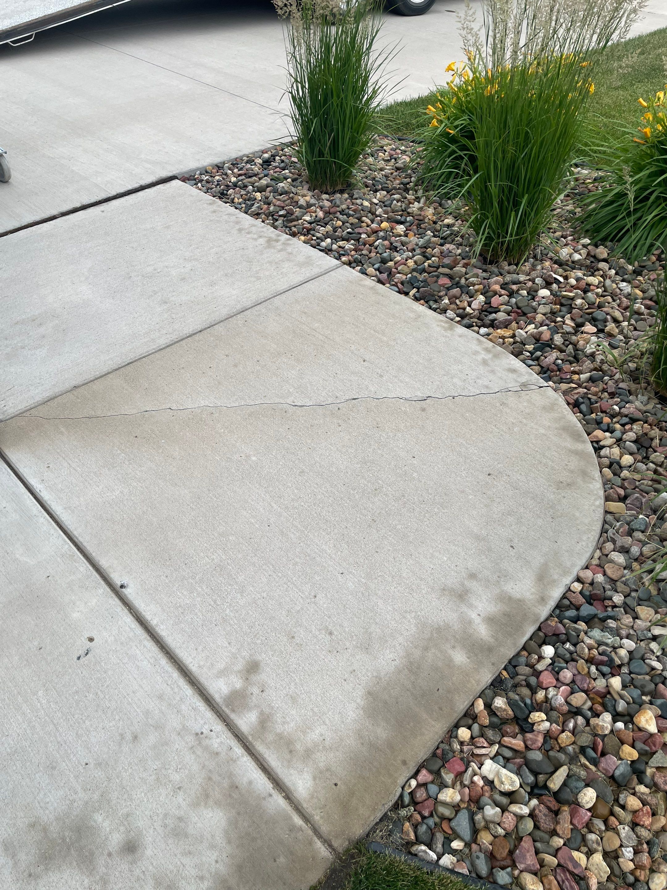 Textured Concrete Patio Coating and Custom Privacy Pergola in Sioux Falls by Select Painting, Coatings & Garage Cabinets