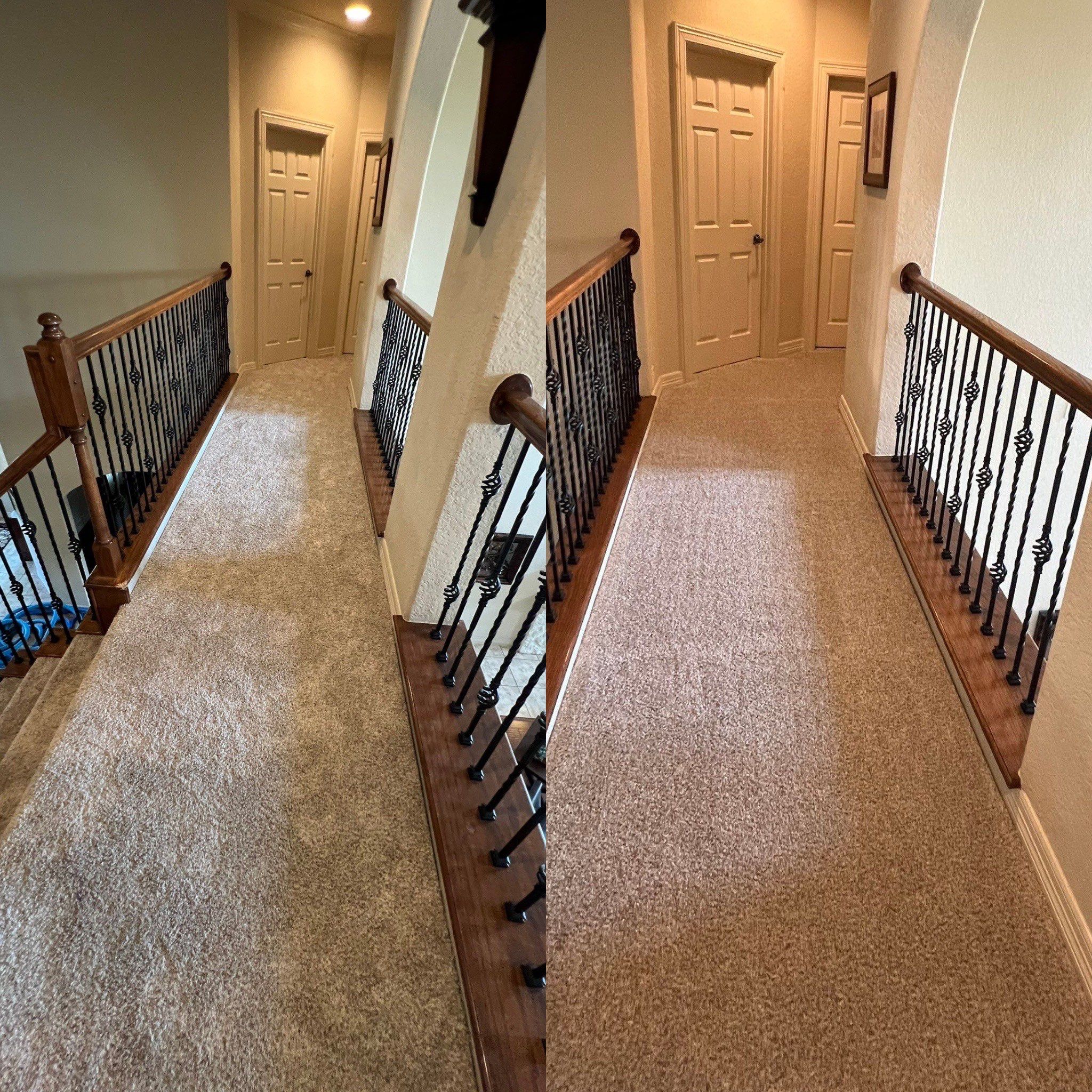 the carpet is being cleaned in a residential hallway and staircase area to remove dirt and stains for improved appearance