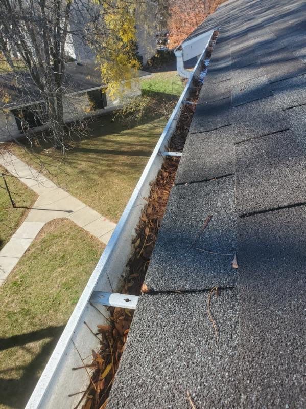 Commercial gutter cleaning Madison before photo with filled gutters