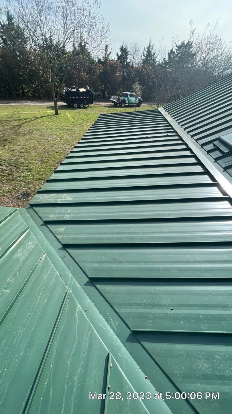 Shingle to Standing Seam Metal Roof by Springtree Restoration 