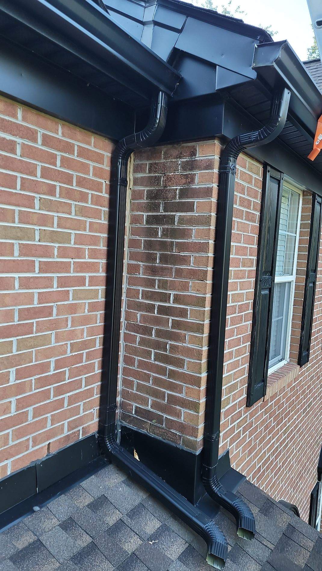 Gutter Installation using Black Gutters, soffit & fascia by Roof Right Inc