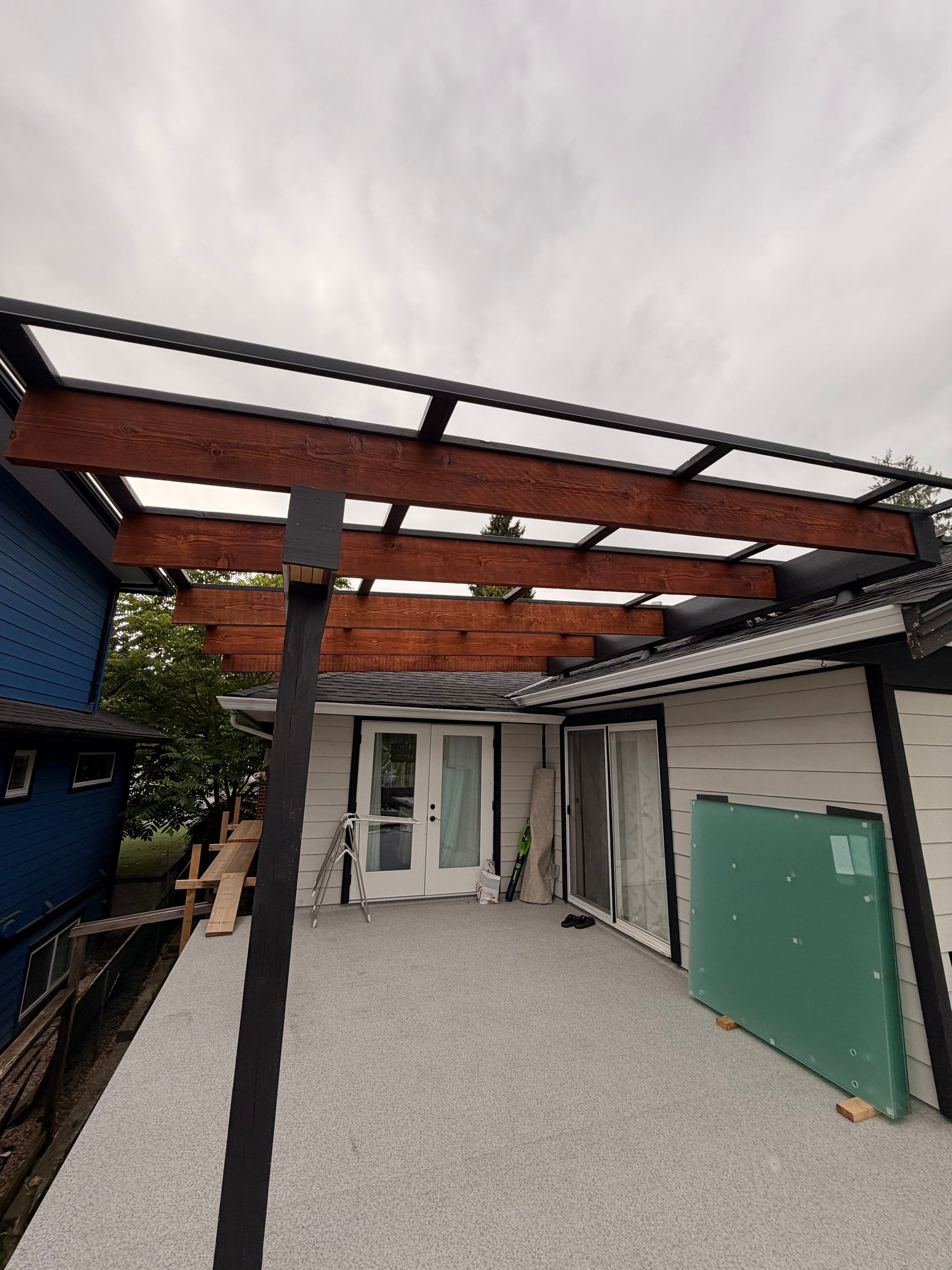 New Composite Deck with glass railing in North Vancouver by YVR Construction Group