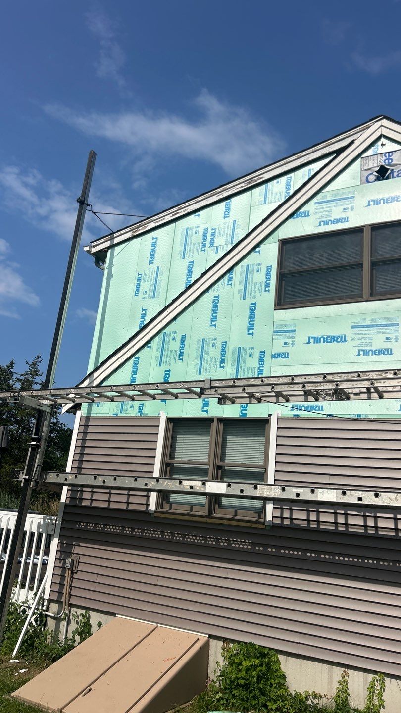 Siding Upgrade with Cert Monogram D/4 x 12'6" clapboard, Weathered Wood by DiGiorgi Roofing and Siding Inc