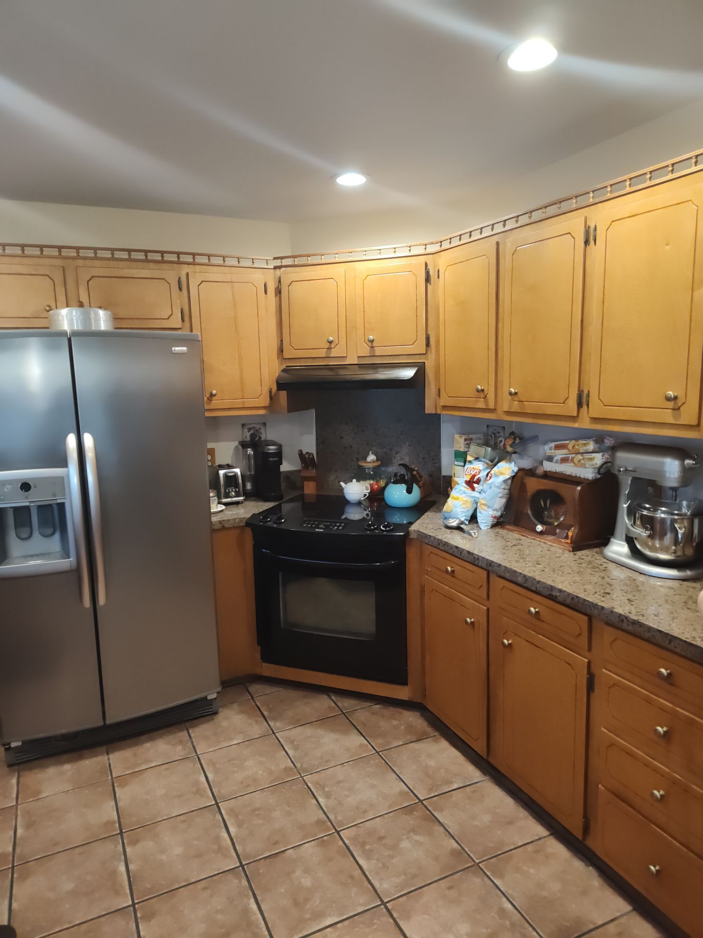 Remodel Kitchen refinishing cabinets by Cornerstone Home Builders, LLC